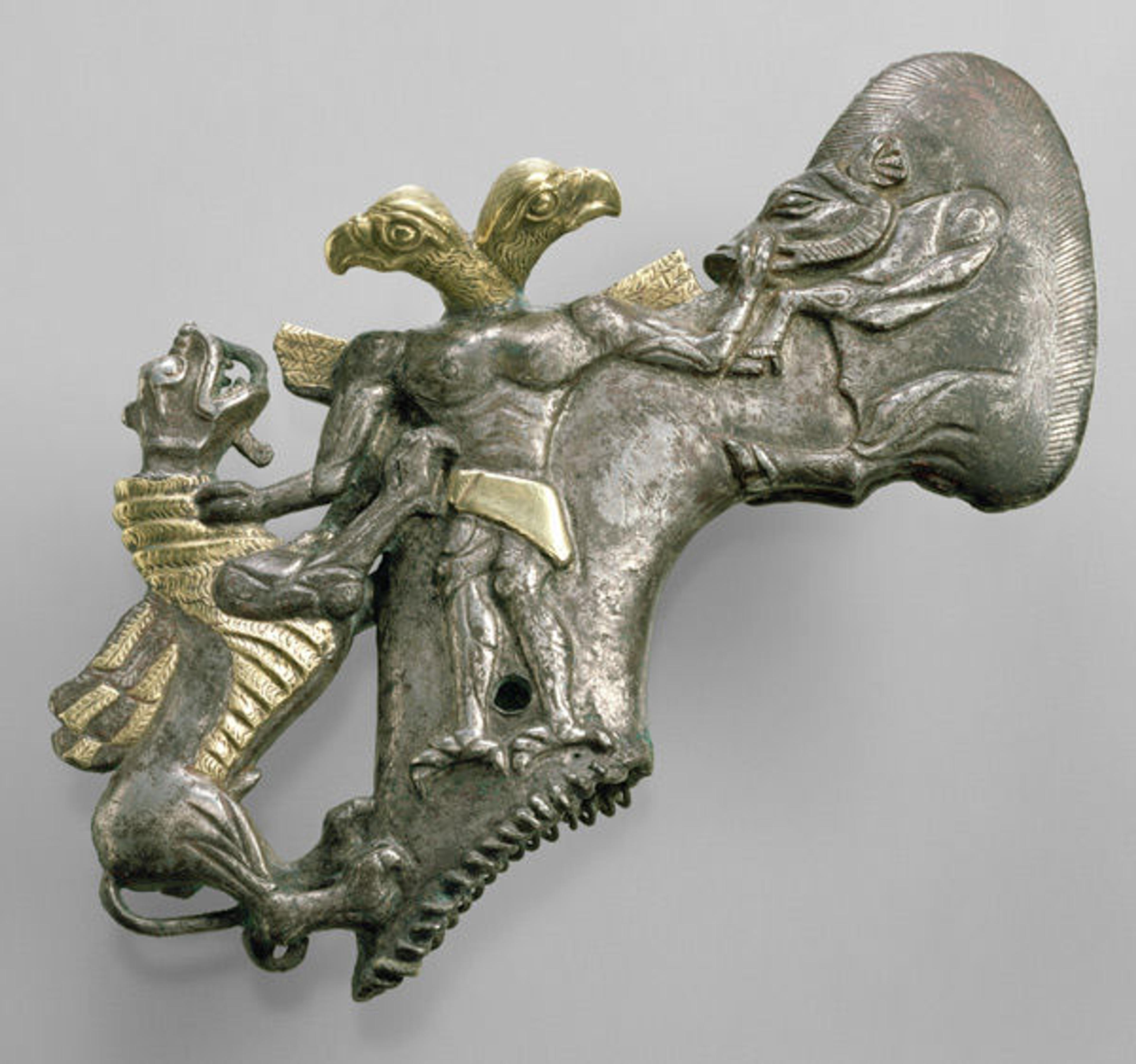 Shaft-hole axe head with bird-headed demon, boar, and dragon, ca. late 3rd–early 2nd millennium B.C. Bactria-Margiana. Silver, gold foil; L. 15 cm. The Metropolitan Museum of Art, New York, Purchase, Harris Brisbane Dick Fund, and James N. Spear and Schimmel Foundation Inc. Gifts, 1982 (1982.5)