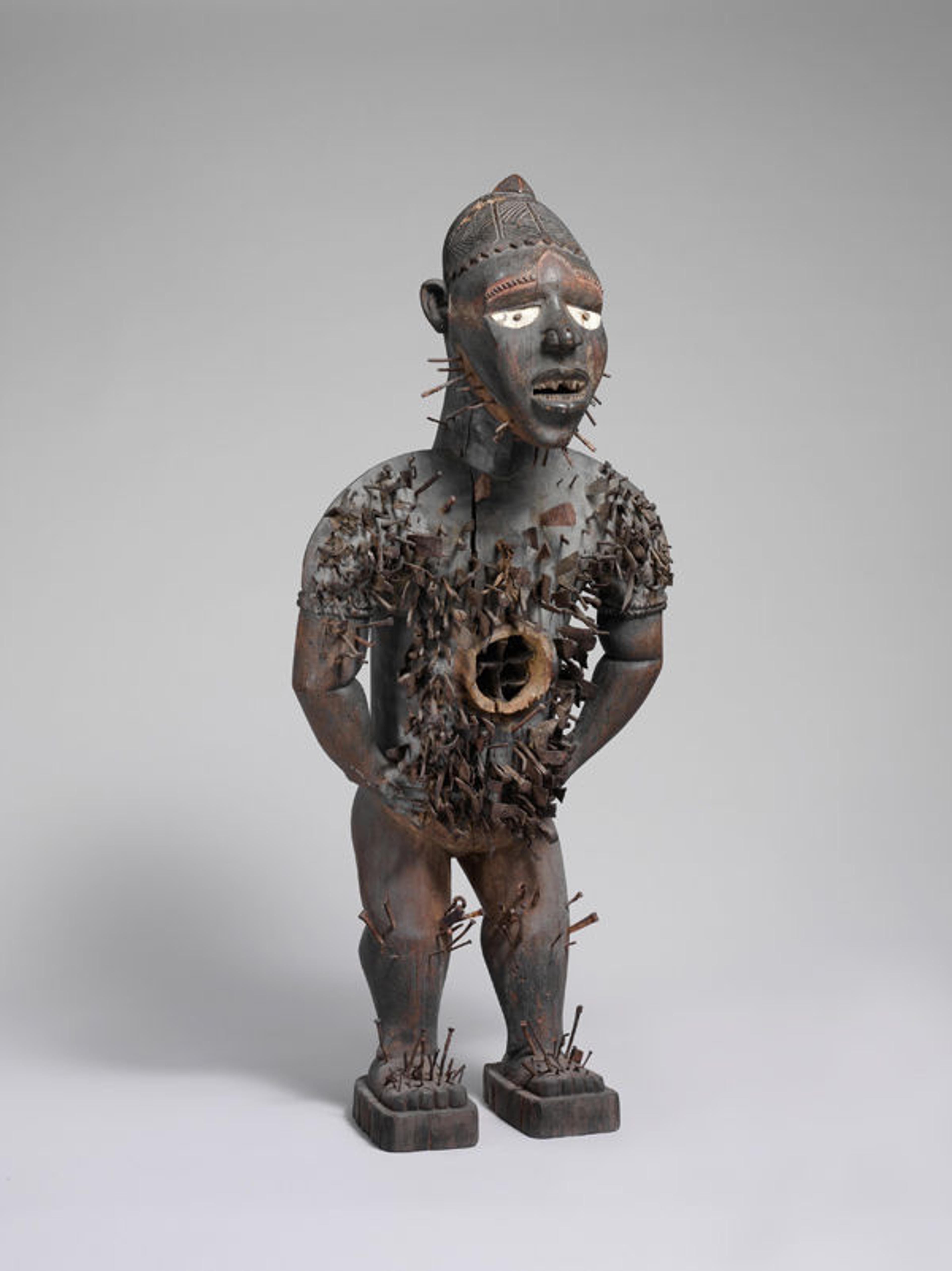 Power Figure (Nkisi N'Kondi: Mangaaka), 19th century. Republic of the Congo or Cabinda, Angola, Chiloango River region. Kongo peoples; Yombe group. Wood, paint, metal, resin, ceramic; H. 46 1/2 in. (118 cm), W. 19 1/2 in. (49.5 cm), D. 15 1/2 in. (39.4 cm). The Metropolitan Museum of Art, New York,  Purchase, Lila Acheson Wallace, Drs. Daniel and Marian Malcolm, Laura G. and James J. Ross, Jeffrey B. Soref, The Robert T. Wall Family, Dr. and Mrs. Sidney G. Clyman, and Steven Kossak Gifts, 2008 (2008.30)