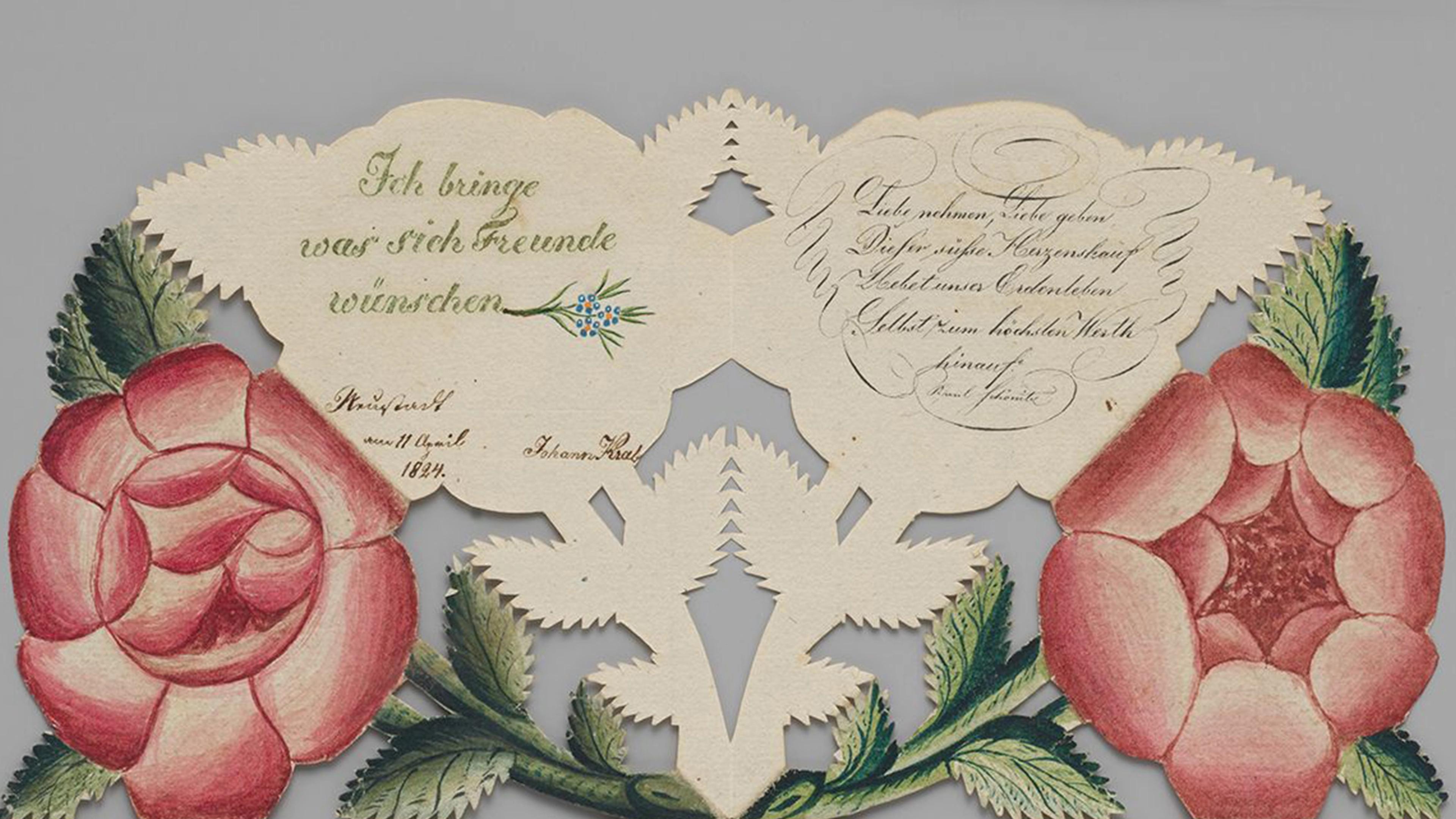 Cut paper greeting card with roses.