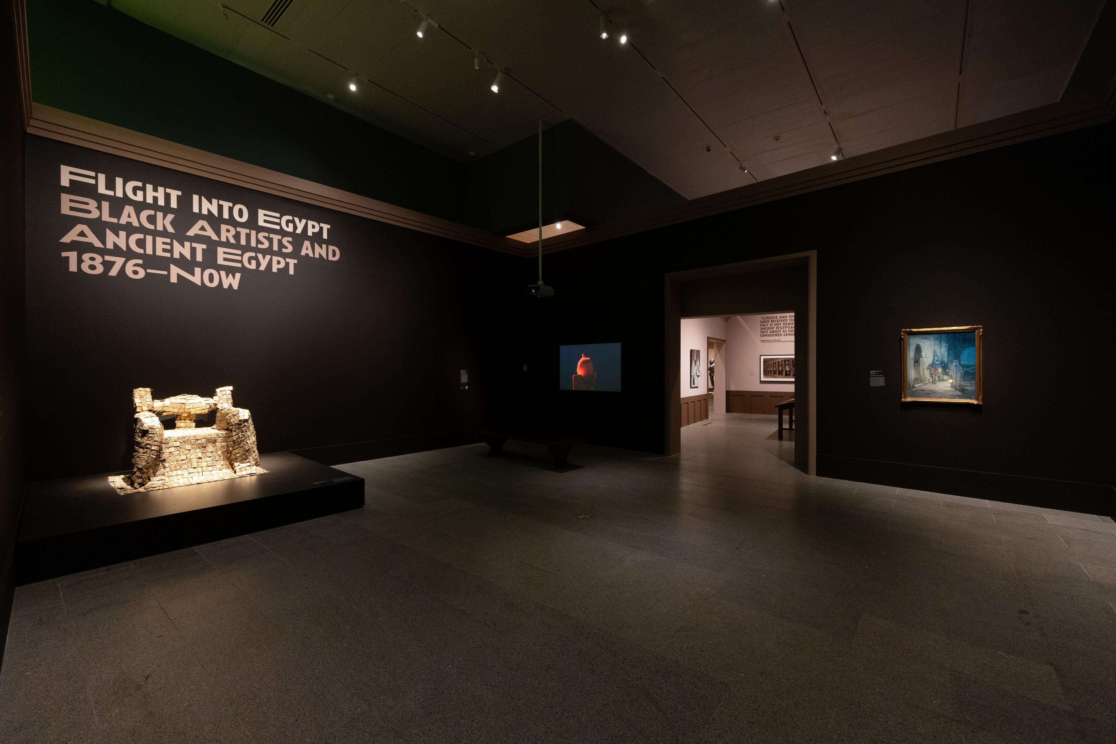 Dark gallery view of the intro wall of Flight Into Egypt.