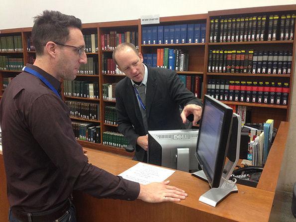 John Lindaman helping a patron