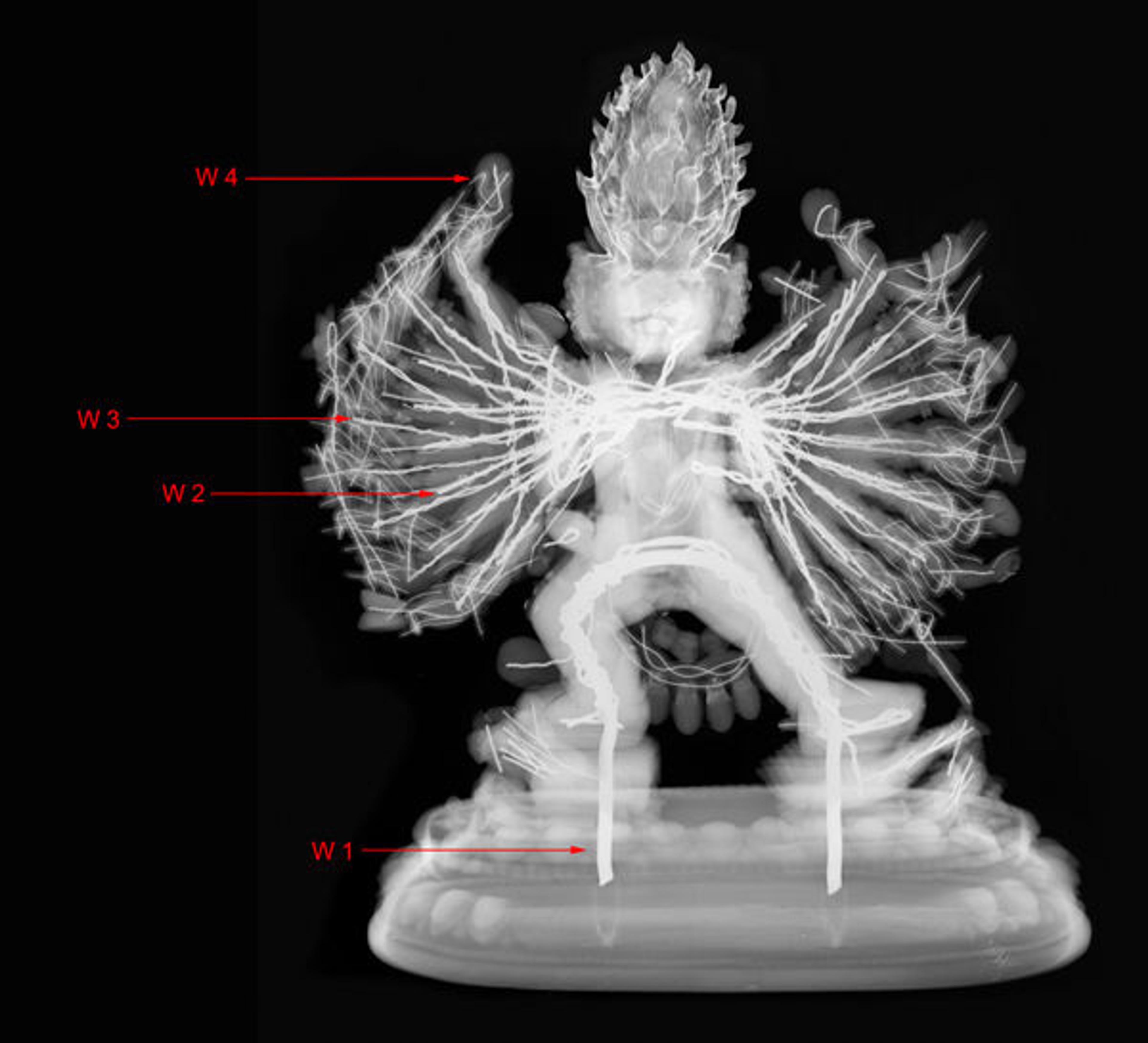 X-ray radiograph of Vajrabhairava (48.30.14). The arrows indicate the four different wire thicknesses.