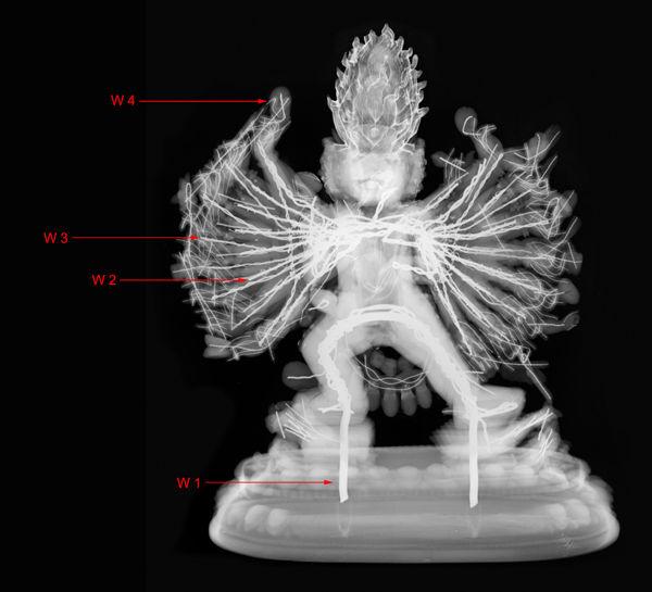 X-ray radiograph of Vajrabhairava (48.30.14). The arrows indicate the four different wire thicknesses.