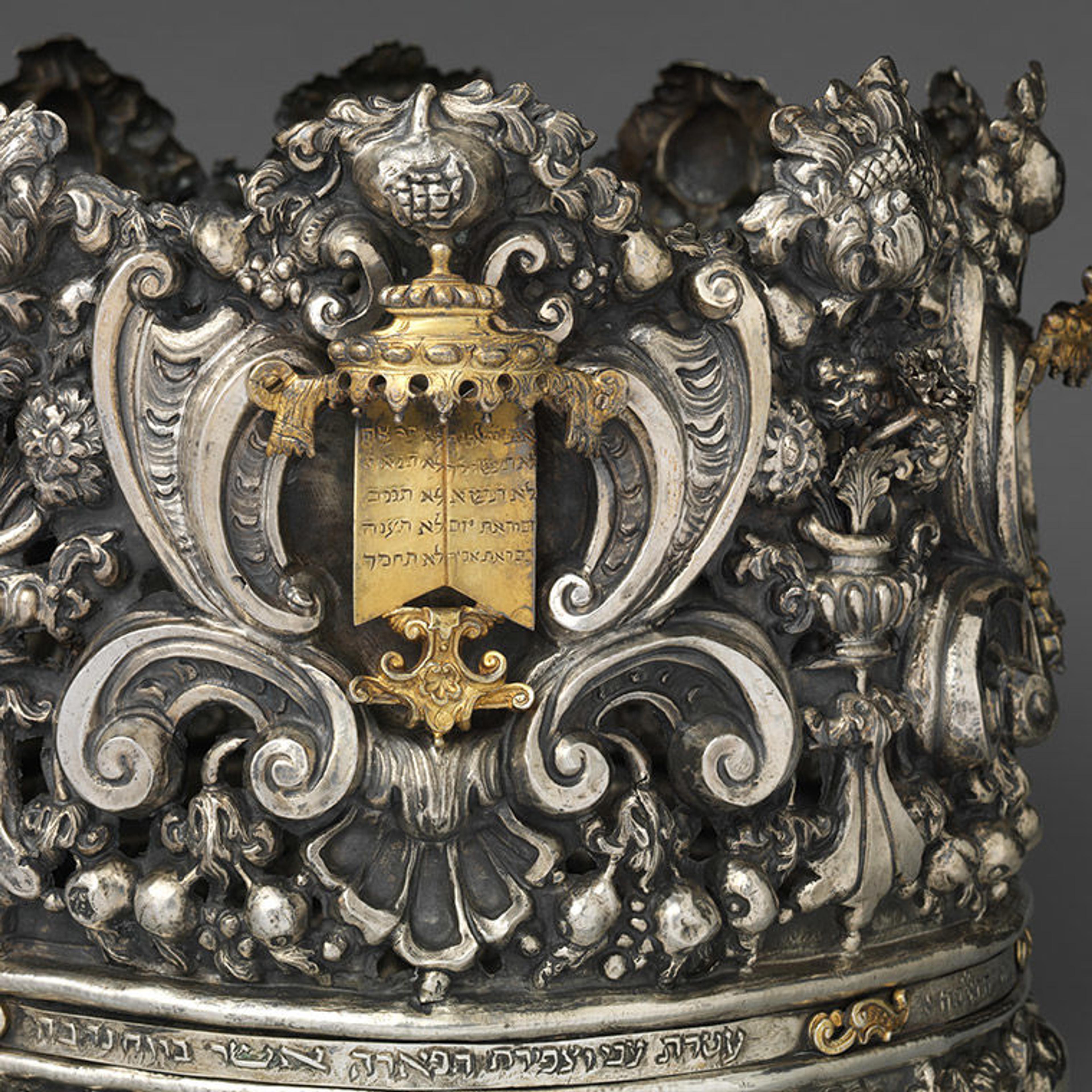 Close-up of a beautiful silver and parcel gilt crown, finely embellished with Judaic motifs.