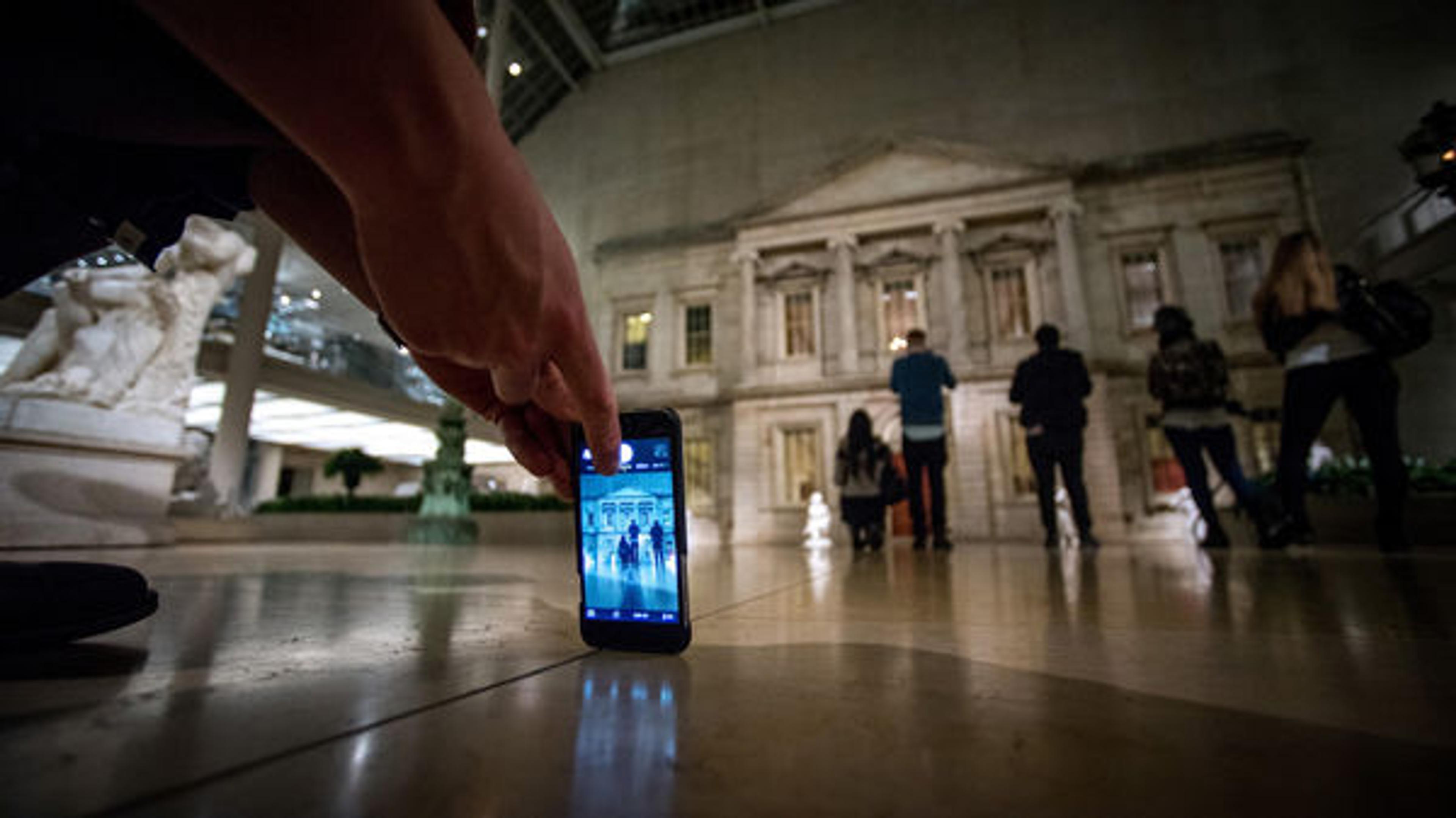 An Instagrammer lines up a shot in the Charles Engelhard Court