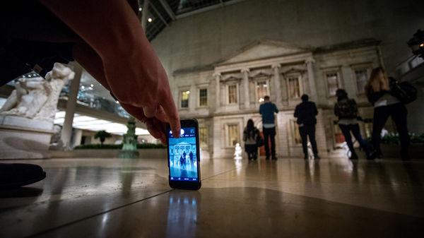 An Instagrammer lines up a shot in the Charles Engelhard Court