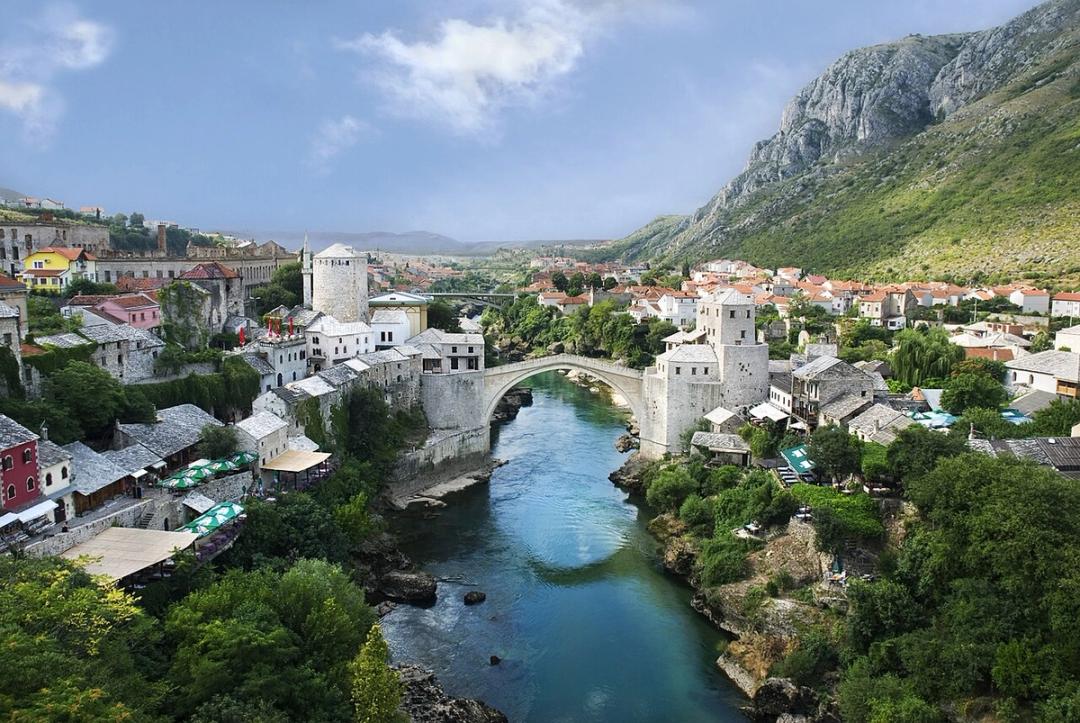 Mostar old town from above, with the Old Bridge over the Neretva and stone houses on both banks