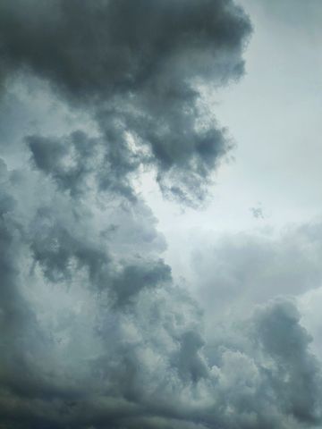 A captivating view of dark storm clouds in the sky, creating a dramatic and moody atmosphere.
