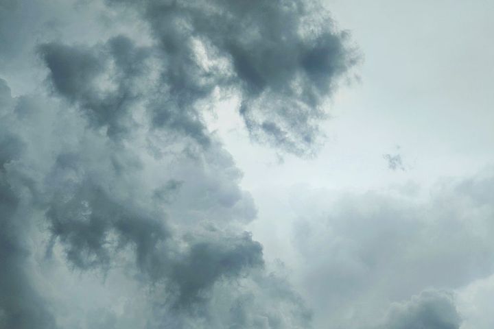 A captivating view of dark storm clouds in the sky, creating a dramatic and moody atmosphere.