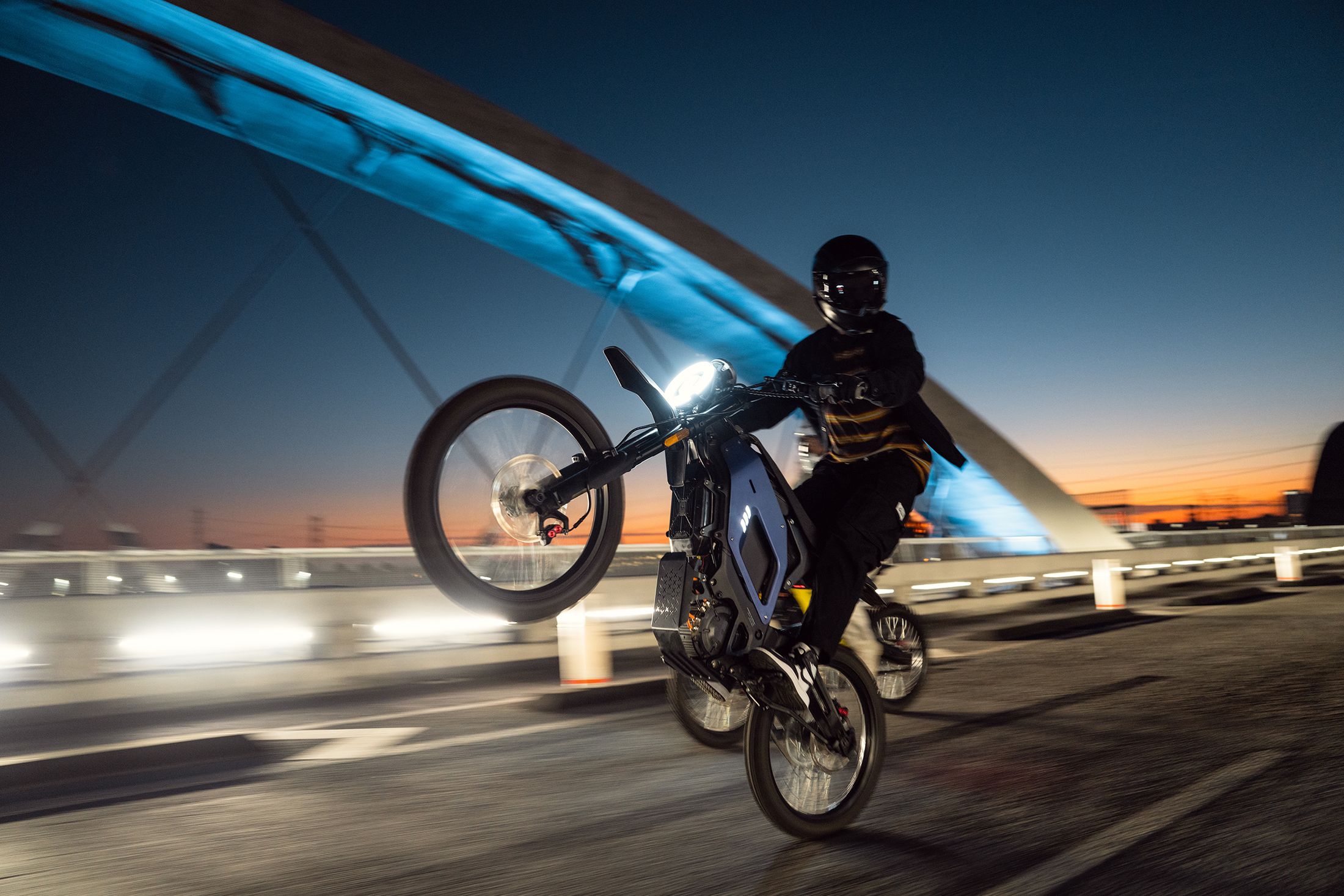 XQi3 rider transitioning from trail to city street