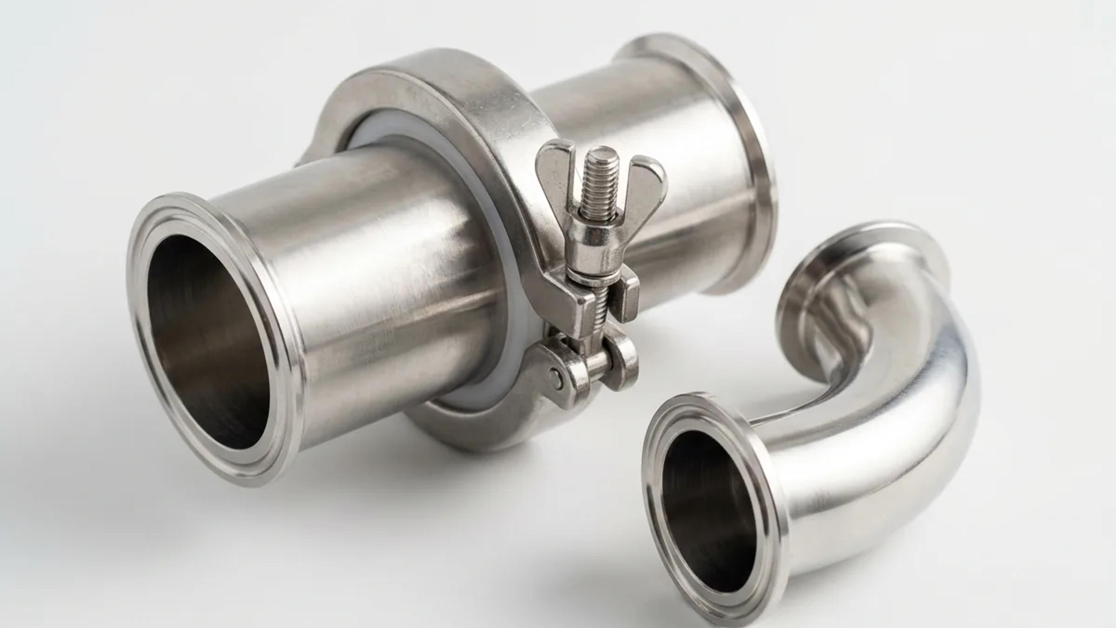 A polished stainless steel tri-clamp hygienic fitting with clamp and gasket