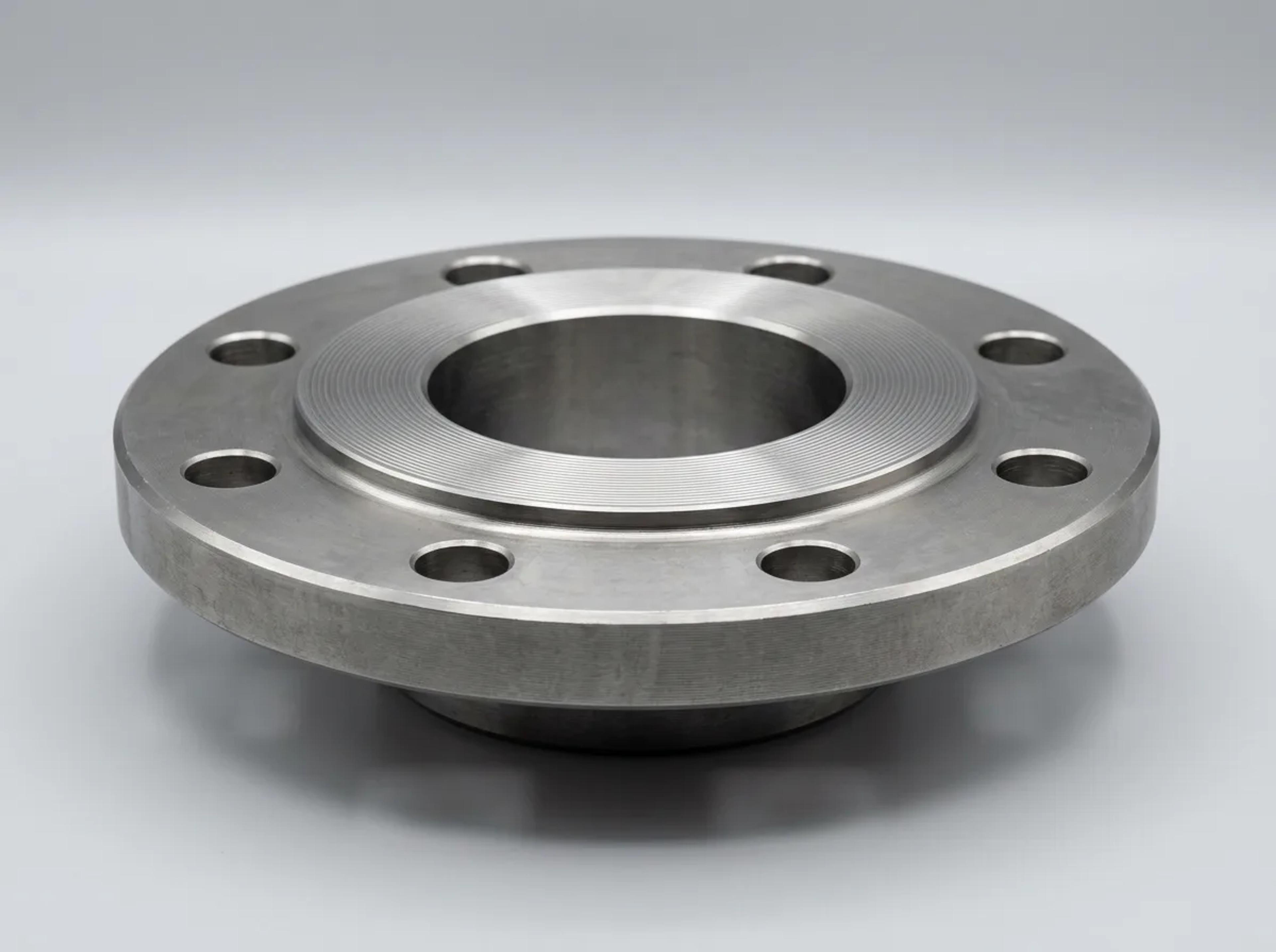 A raised face steel flange with bolt holes