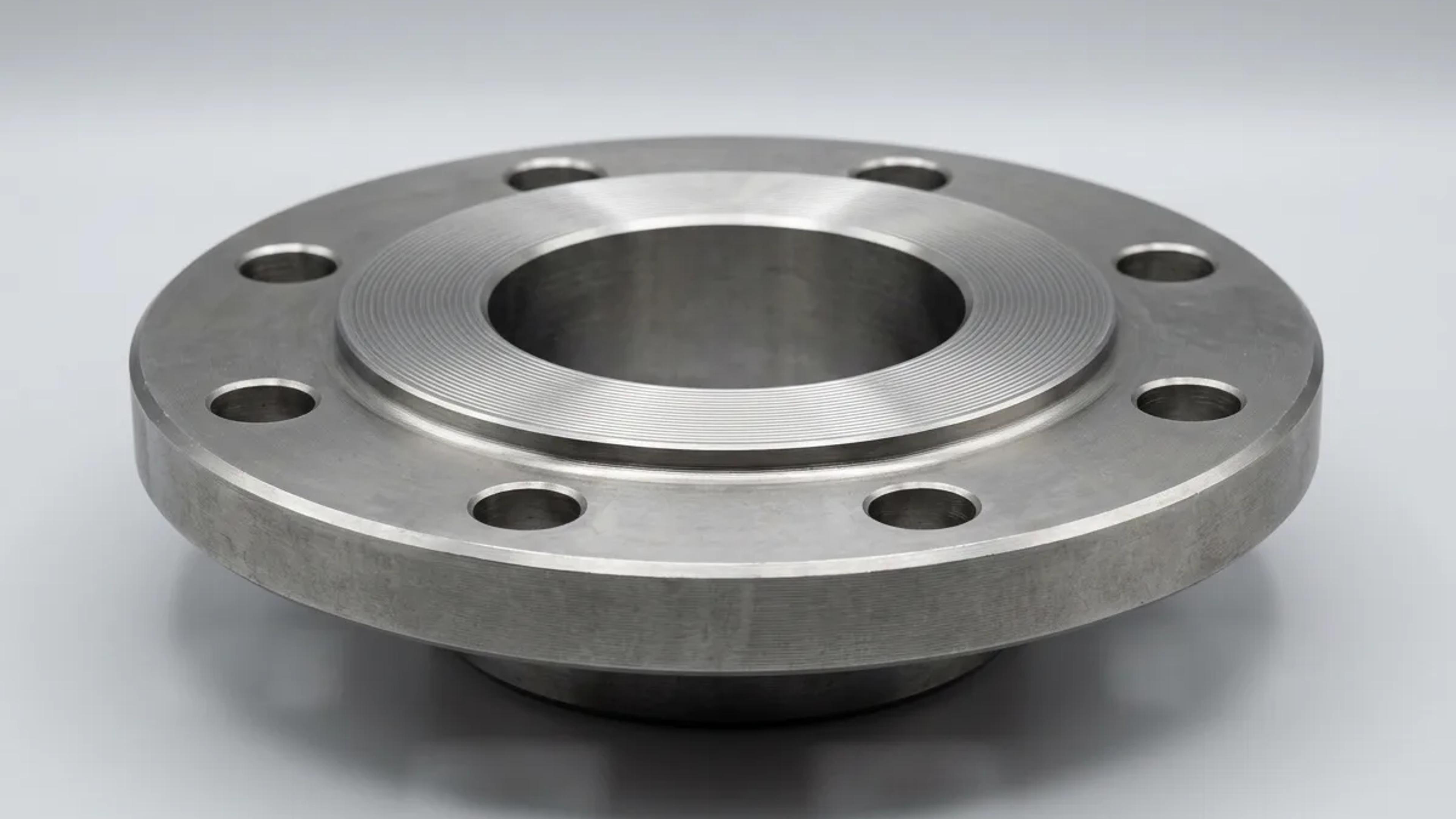 A raised face steel flange with bolt holes