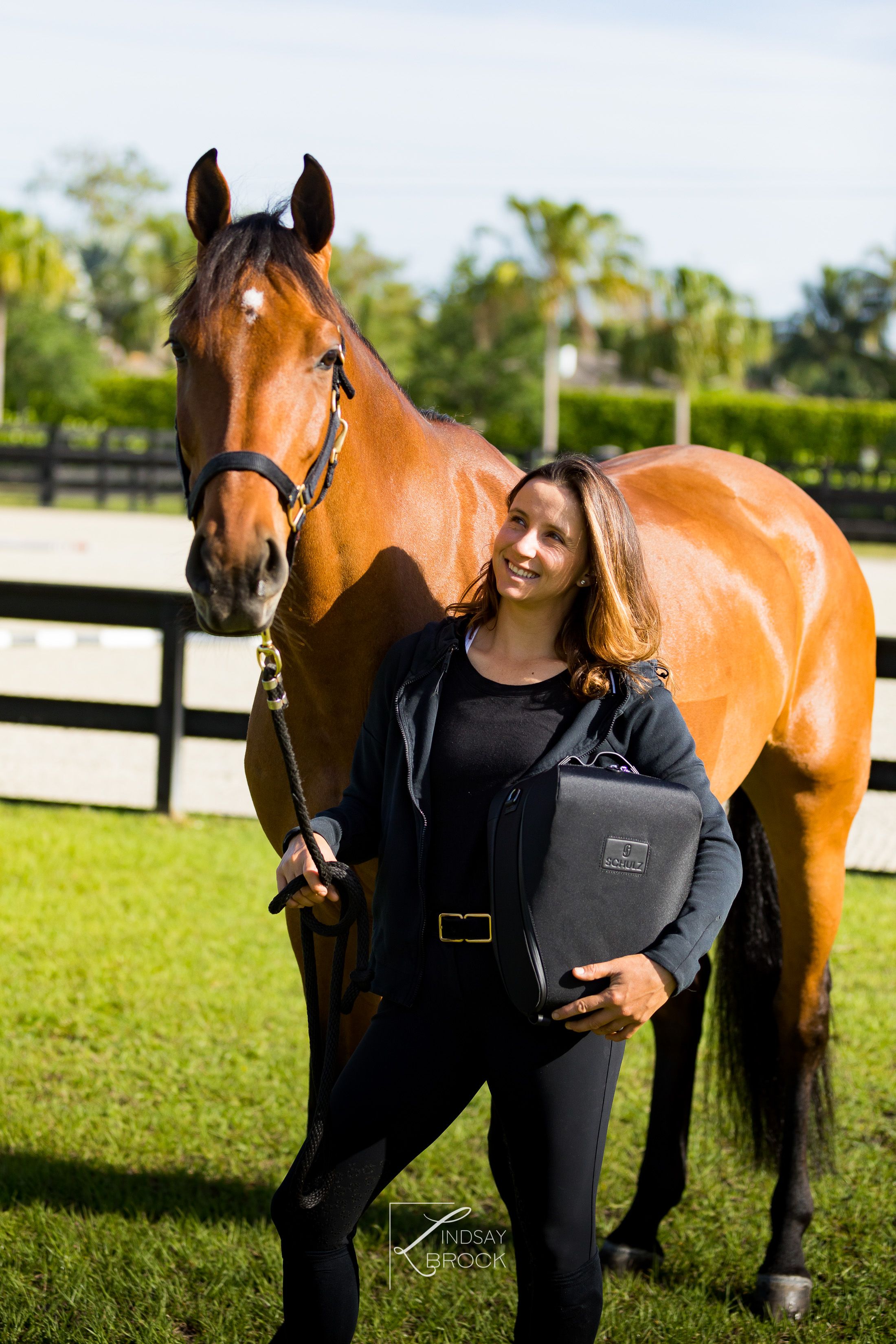 Adrienne with horse and helmet bag