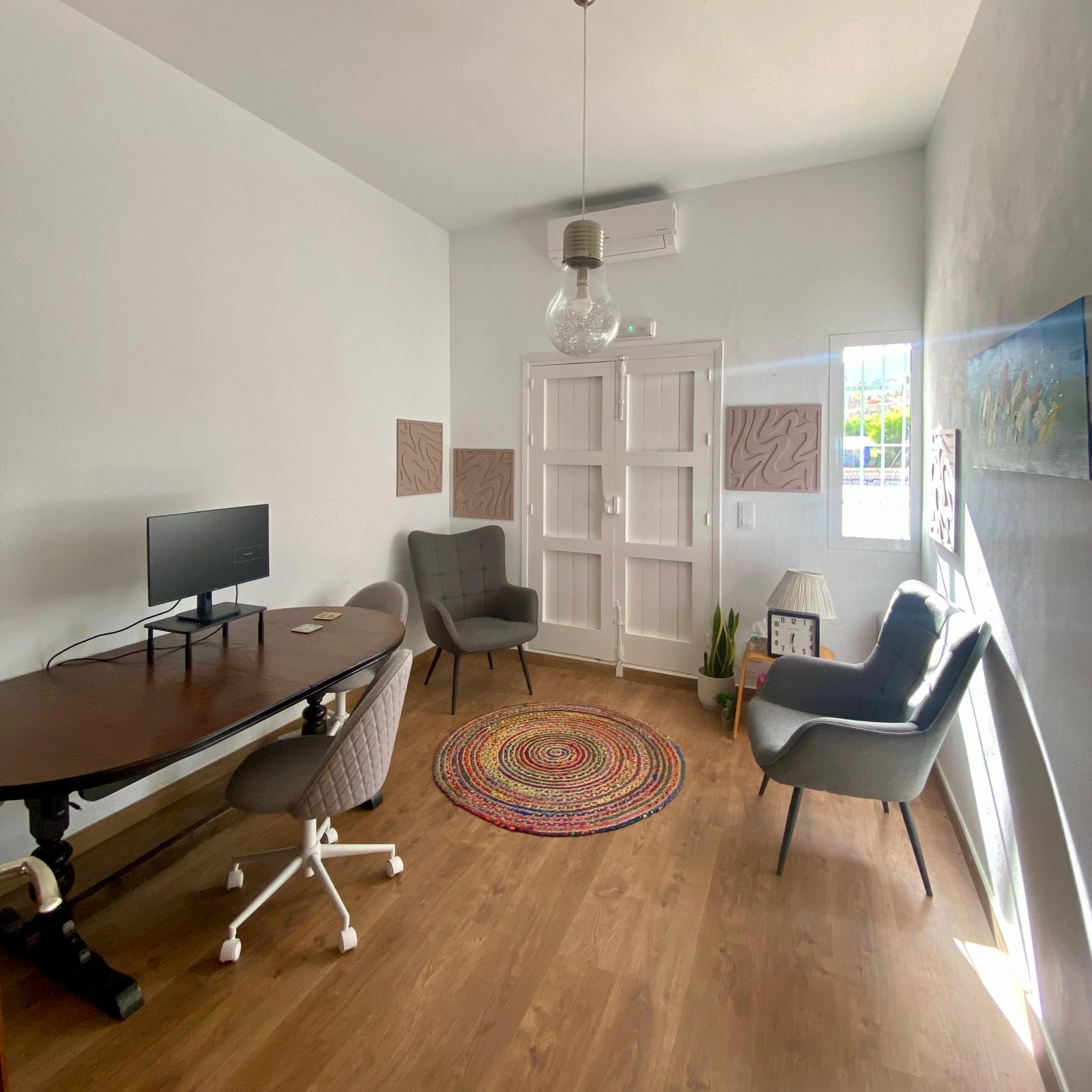 The DeskSpace meeting room seating area, with sea-view window