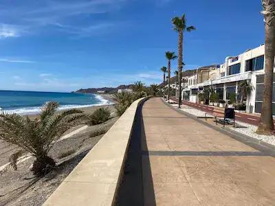 A flat paseo with low rise buildings on the right and the sea on the left. Ideal for cycling, flat walking or pushing a stroller.