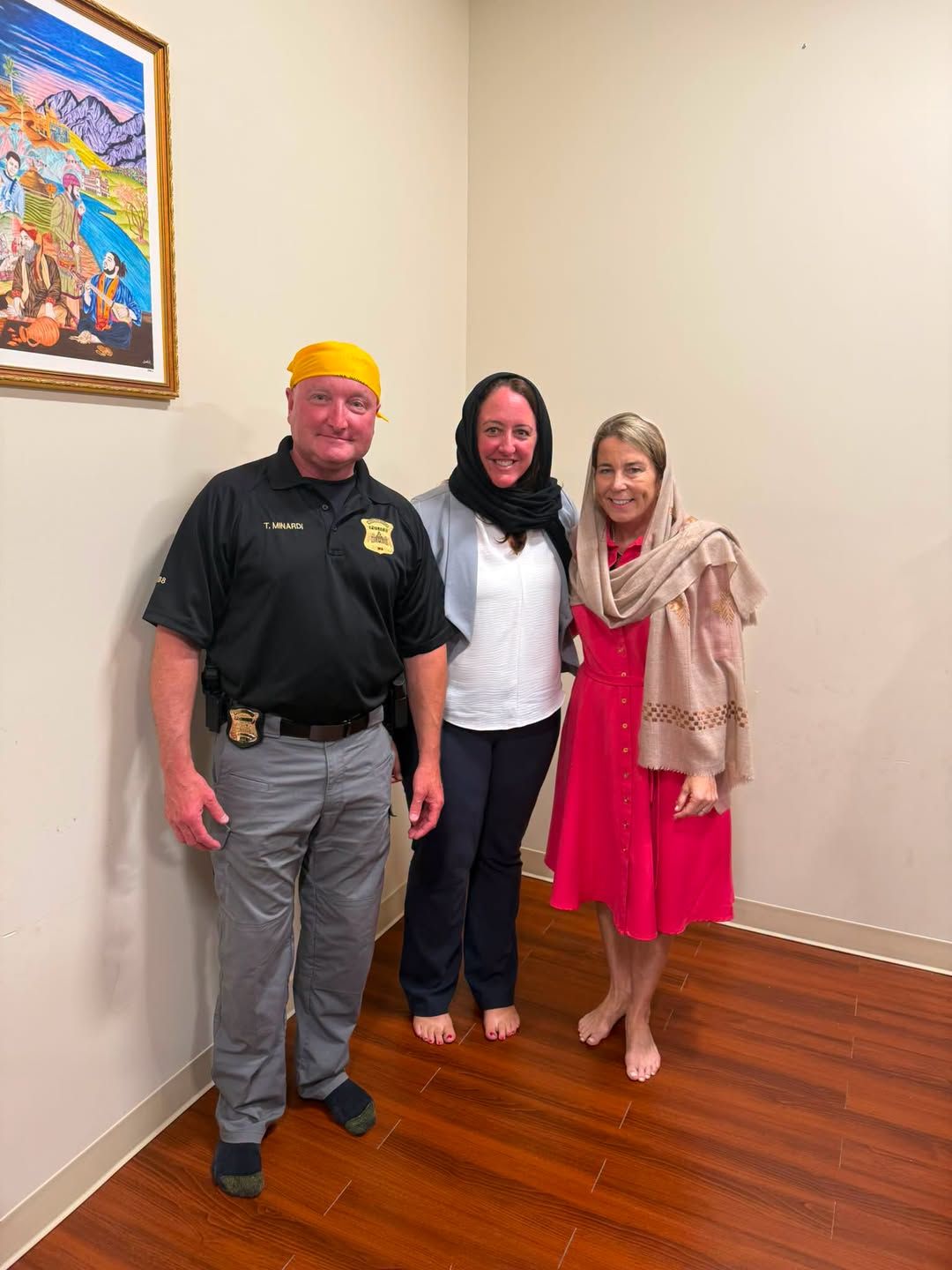 Chief Todd Minardi, left, pictured with Gov. Maura Healey, far right, visiting a Sikh temple. (Westborough Police)