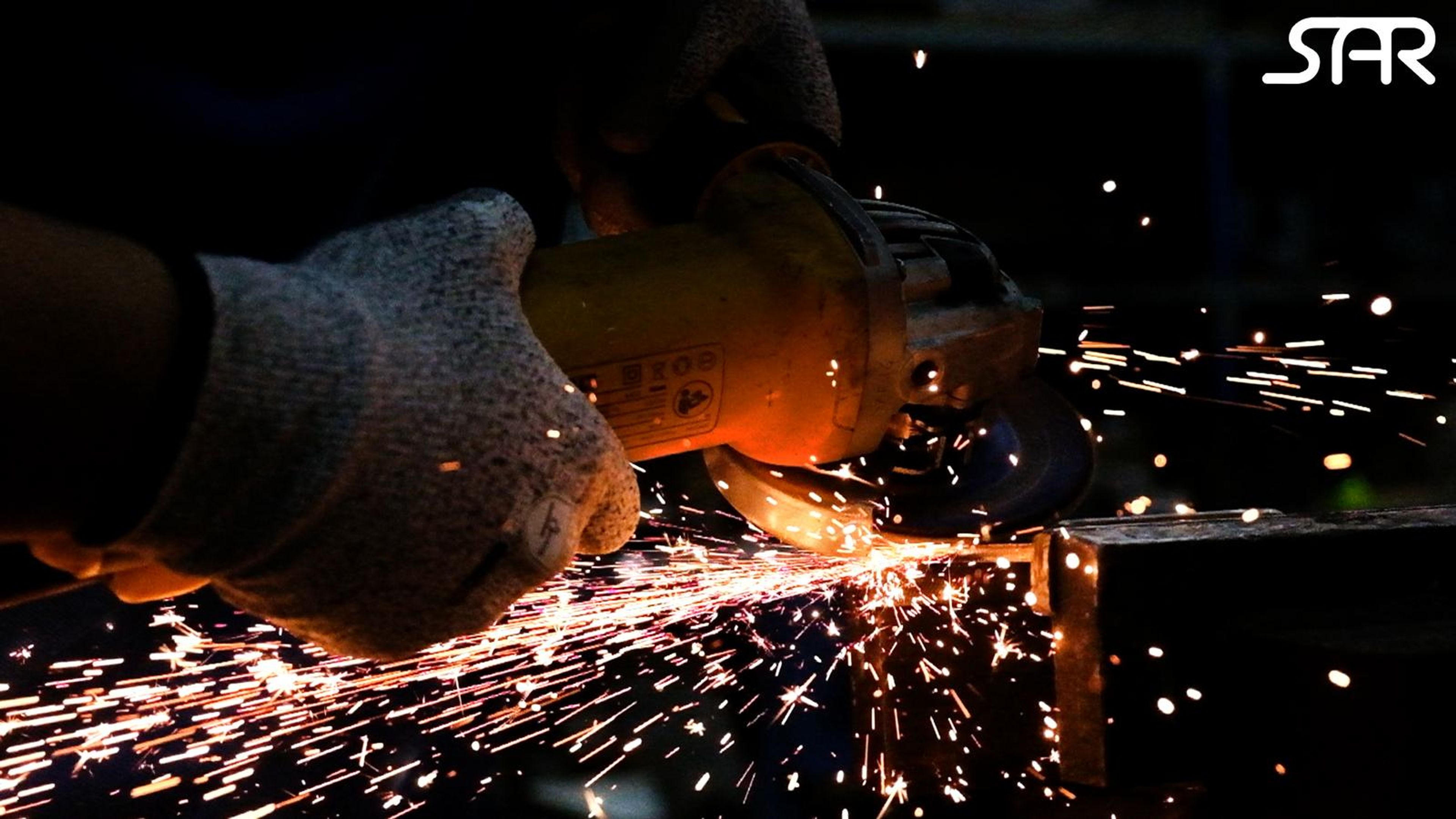 Burst of grinder sparks with the SAR logo in white at the top right
