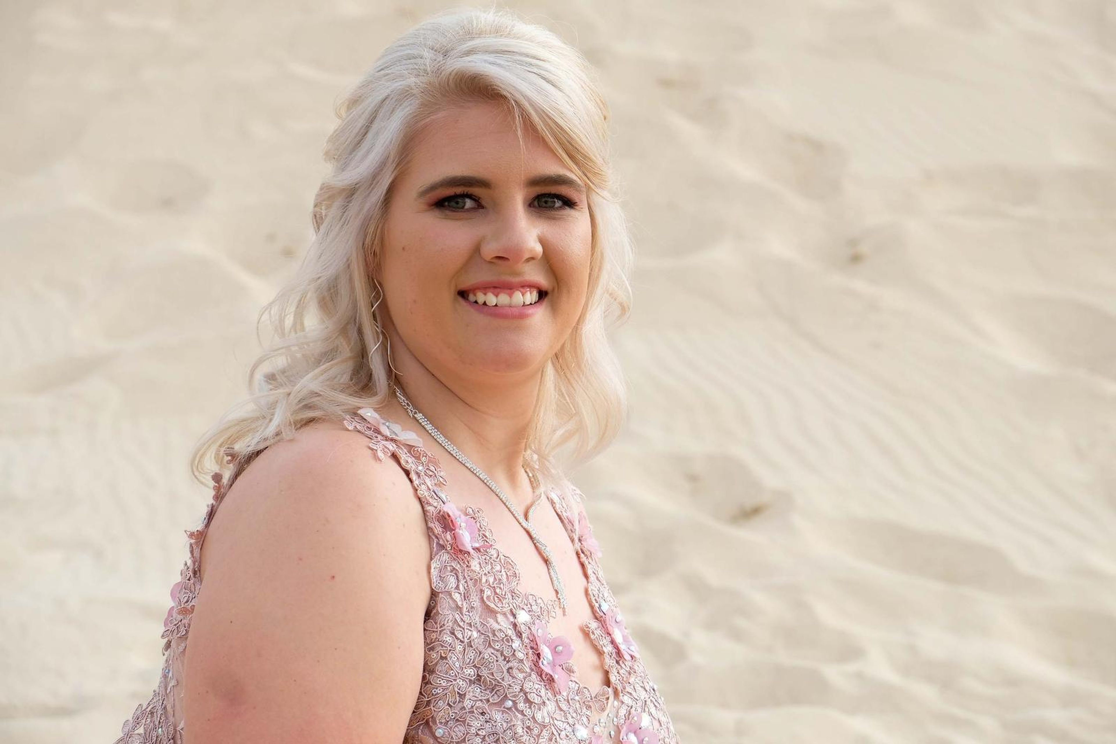 Relaxed smiling portrait on the sand