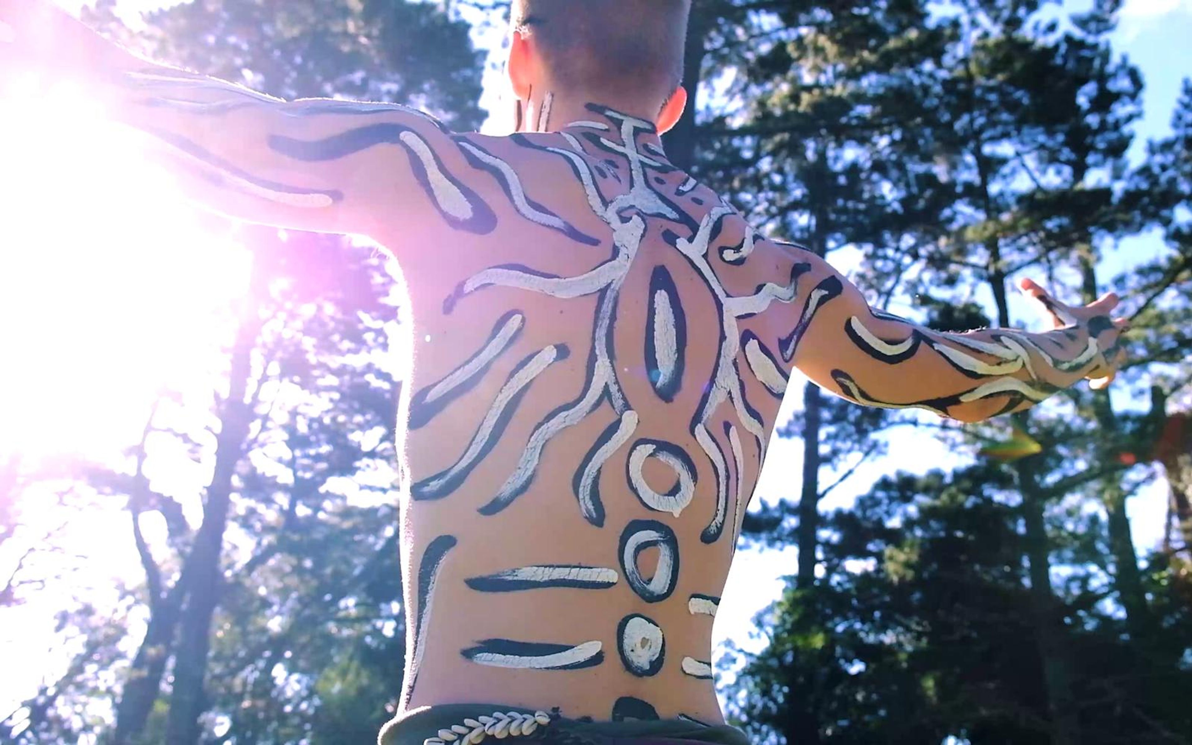 Sunlit painted back with spotted patterns and a purple flare over the shoulder