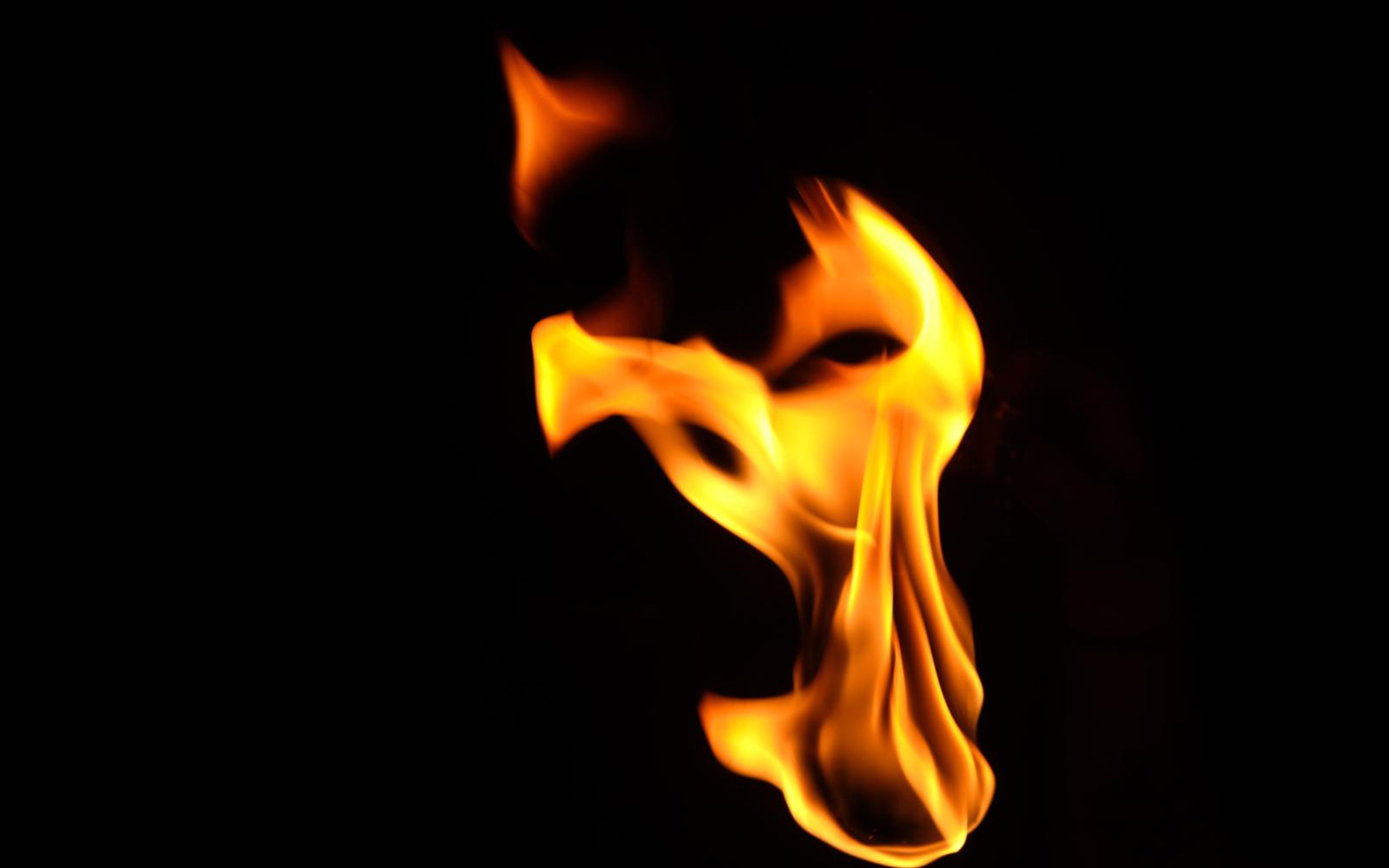 Single flame at right with a hooked top curling to the left