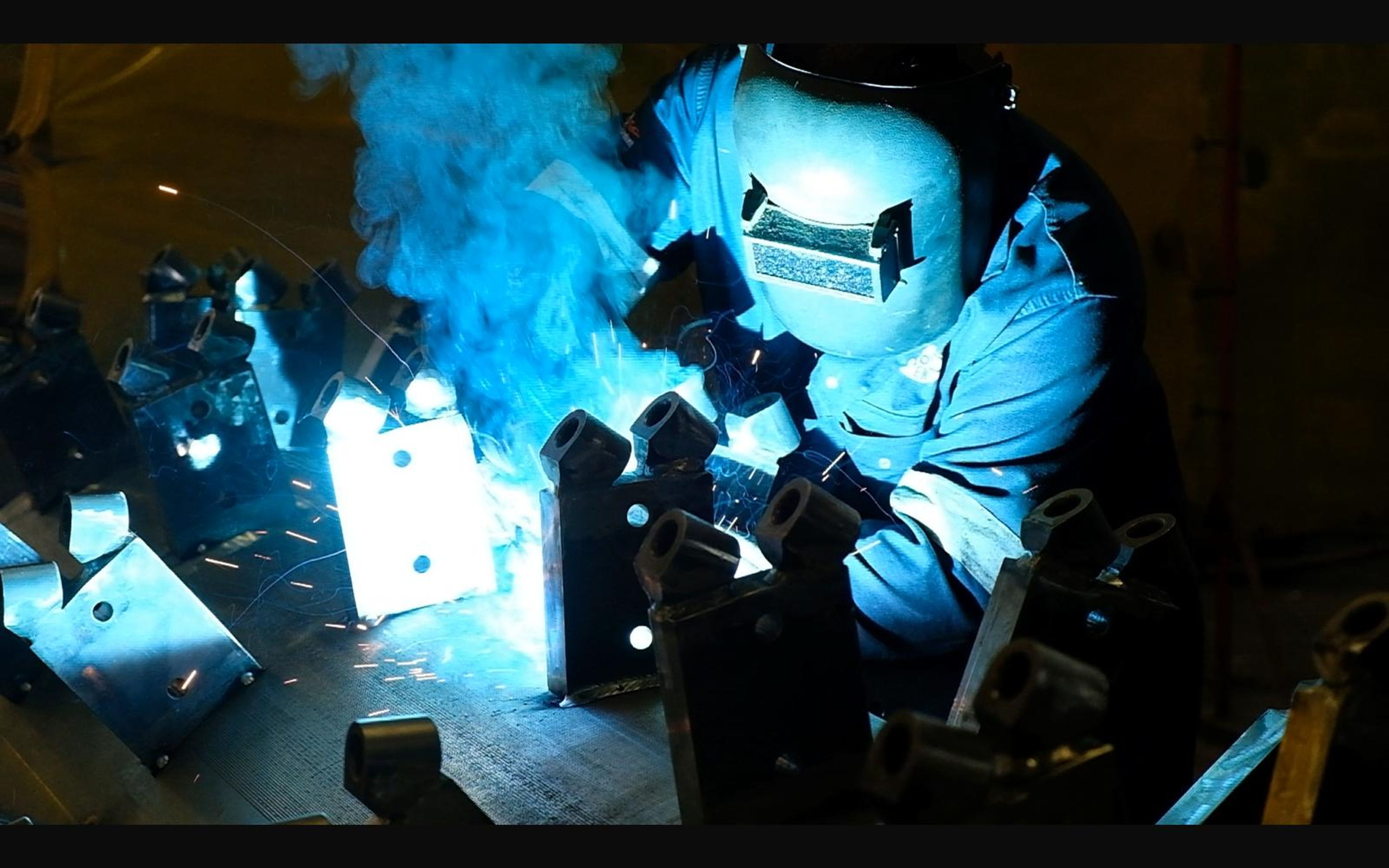 Welder welding steel brackets