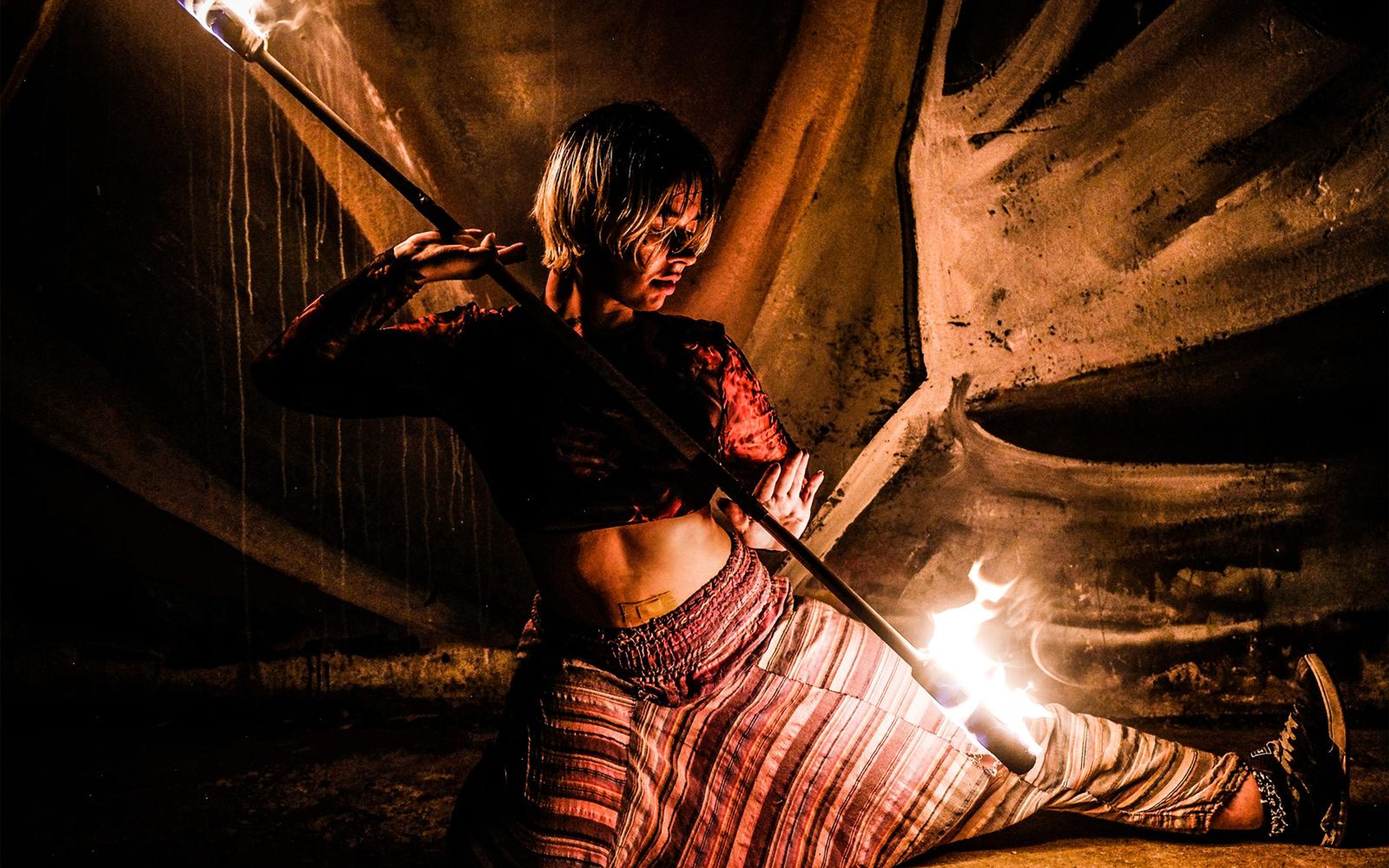 Warmer, higher-contrast version of the side split with a fire staff