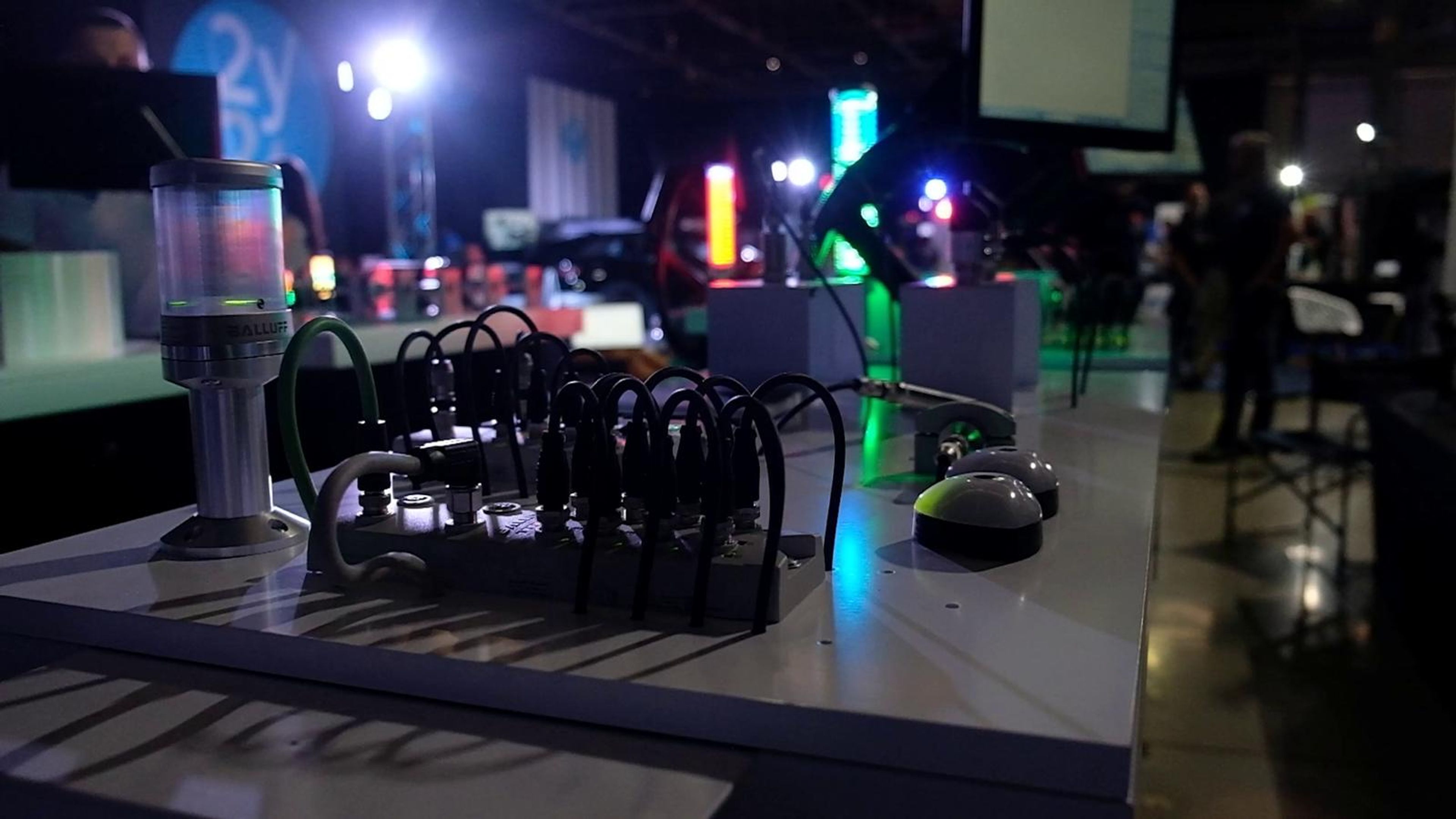 Demonstration table with coloured lights and cables