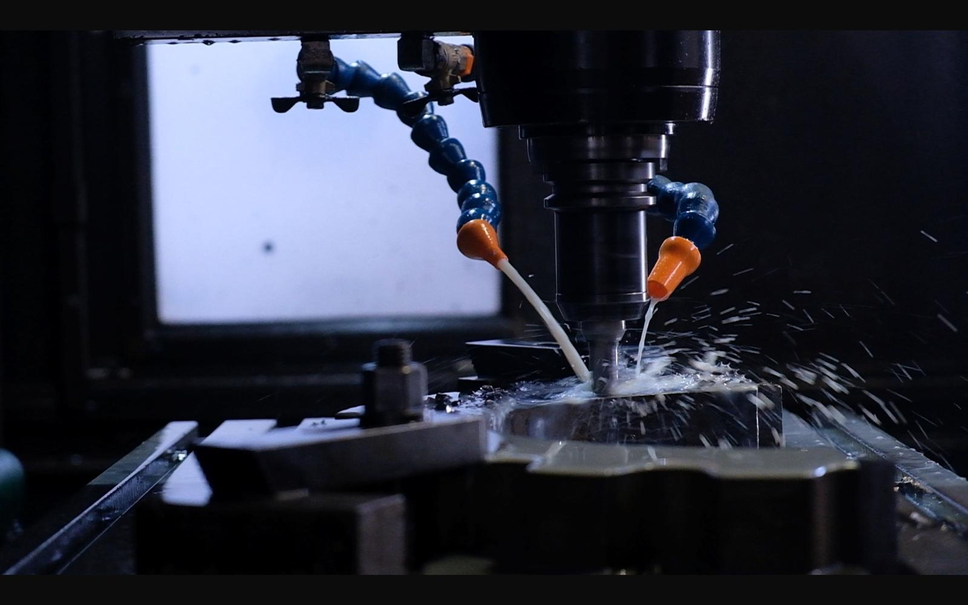 Coolant flowing over a part on a milling machine
