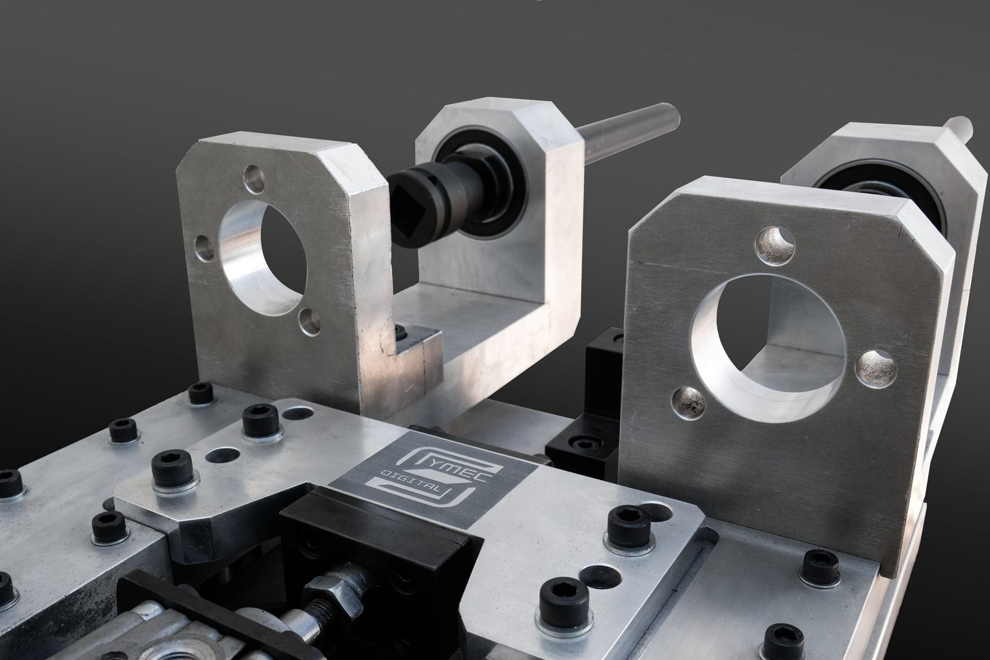 Medium view of the tool's twin bearing housings and shaft