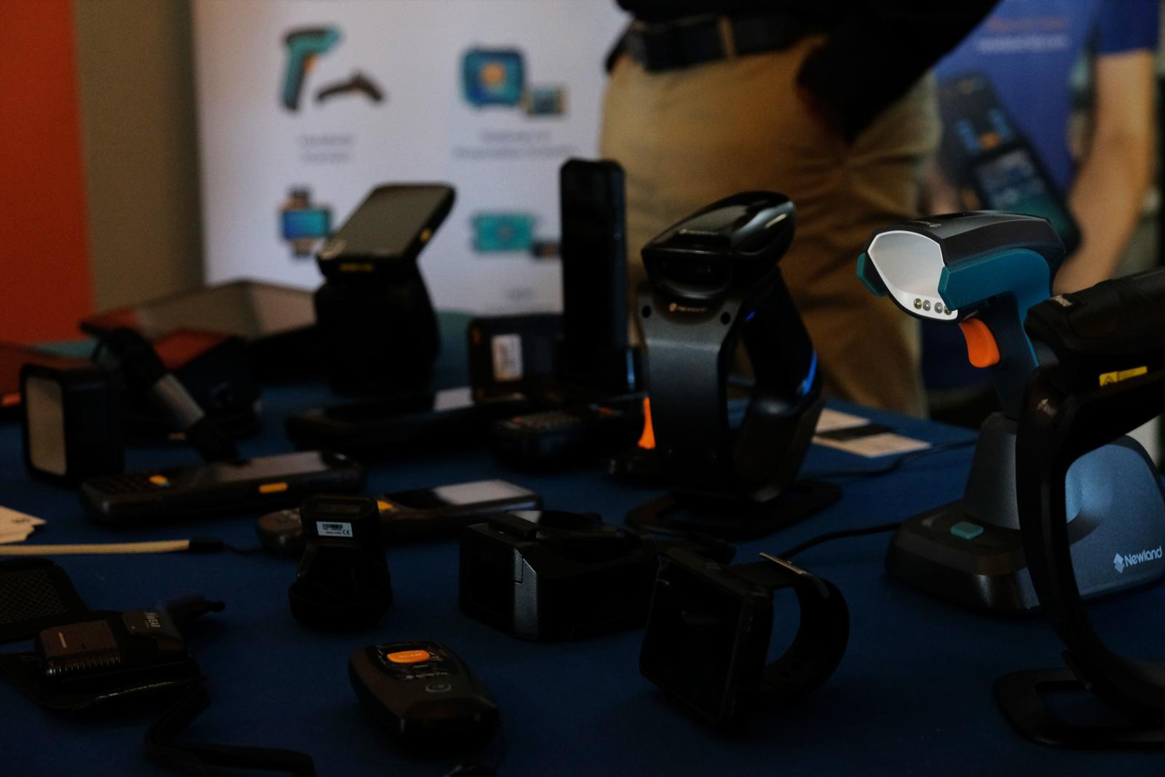 Newland AIDC scanners and wearables displayed on a table