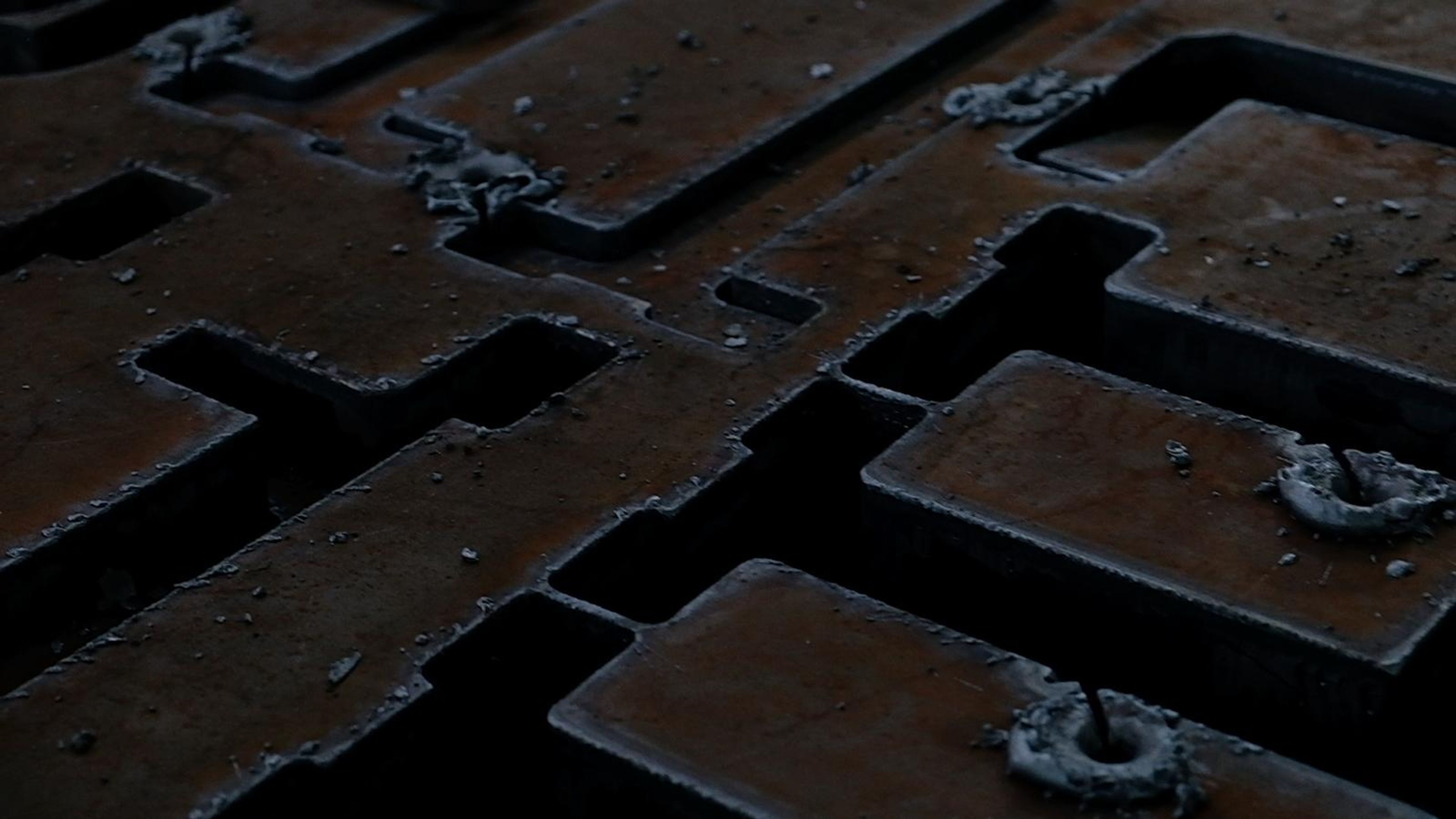 Steel plate with intricate cut profiles, framed a little wider