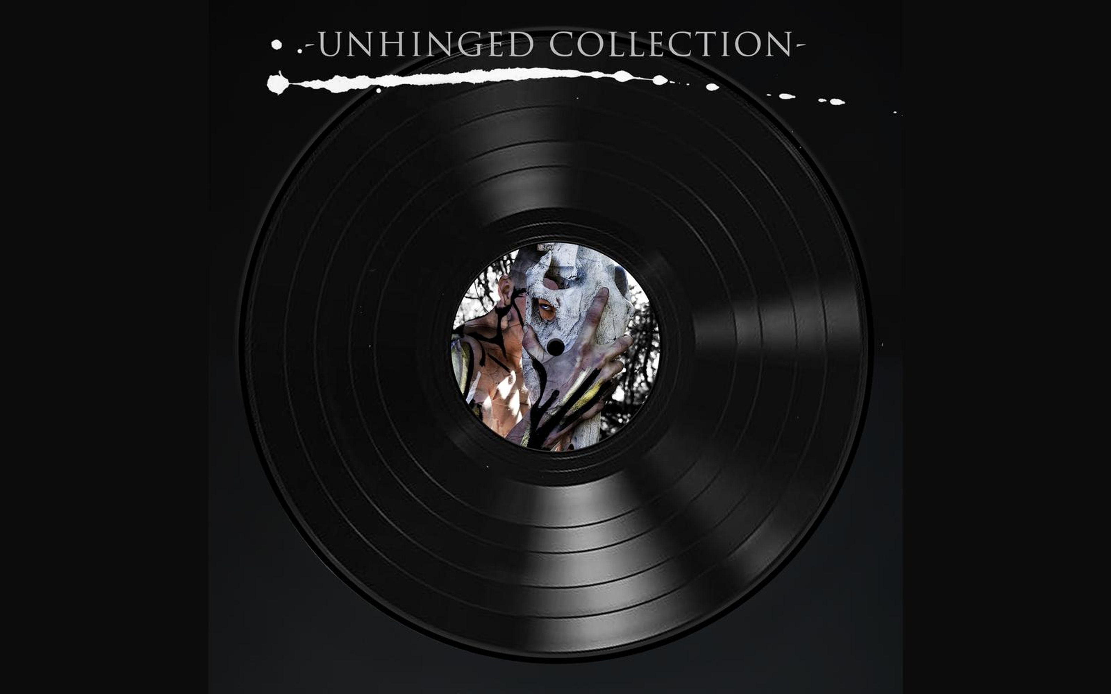 Vinyl record with pale marbled artwork inside a triangle on its label and title lettering above