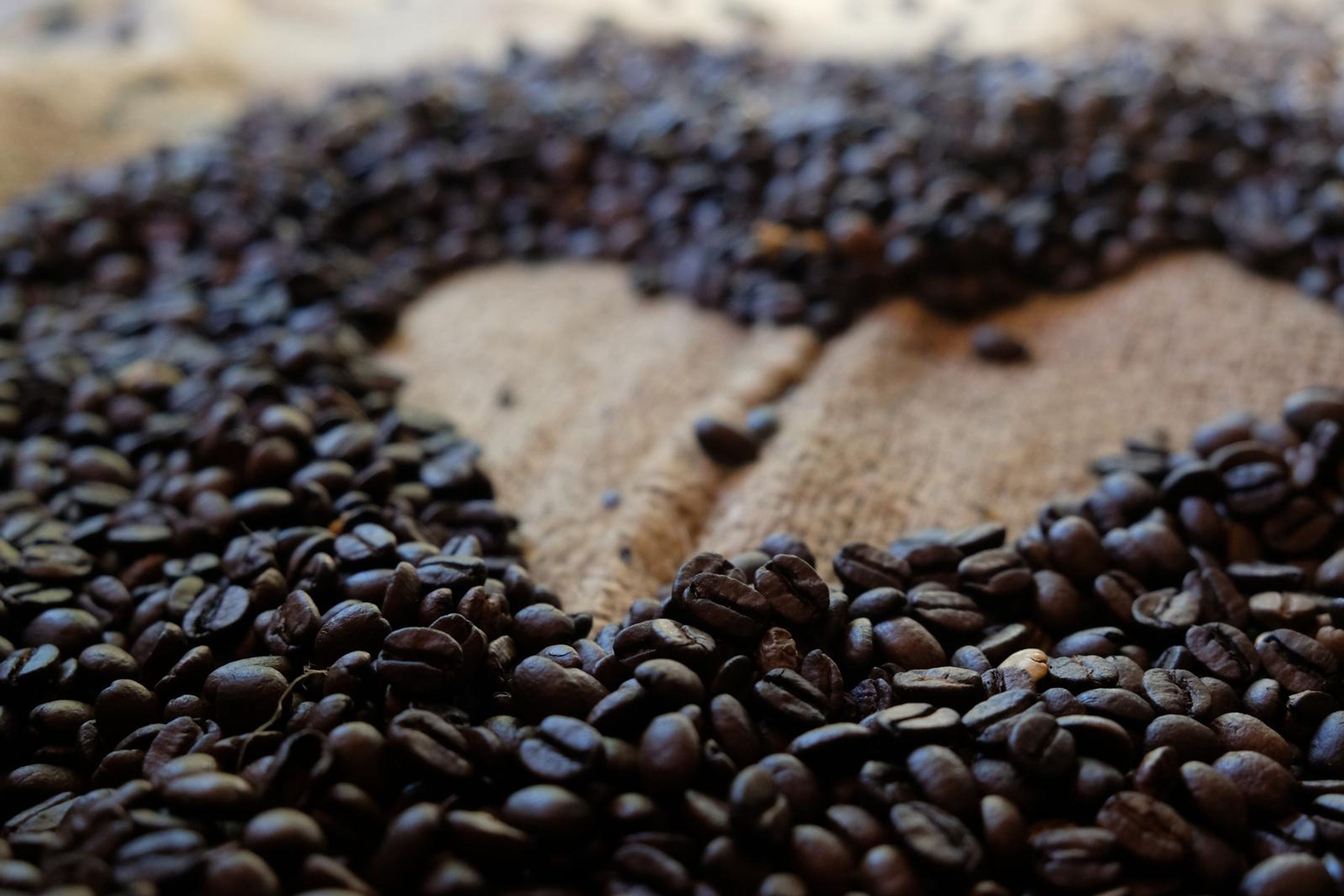 Death By Coffee creative product photography of coffee, beans and branded bags
