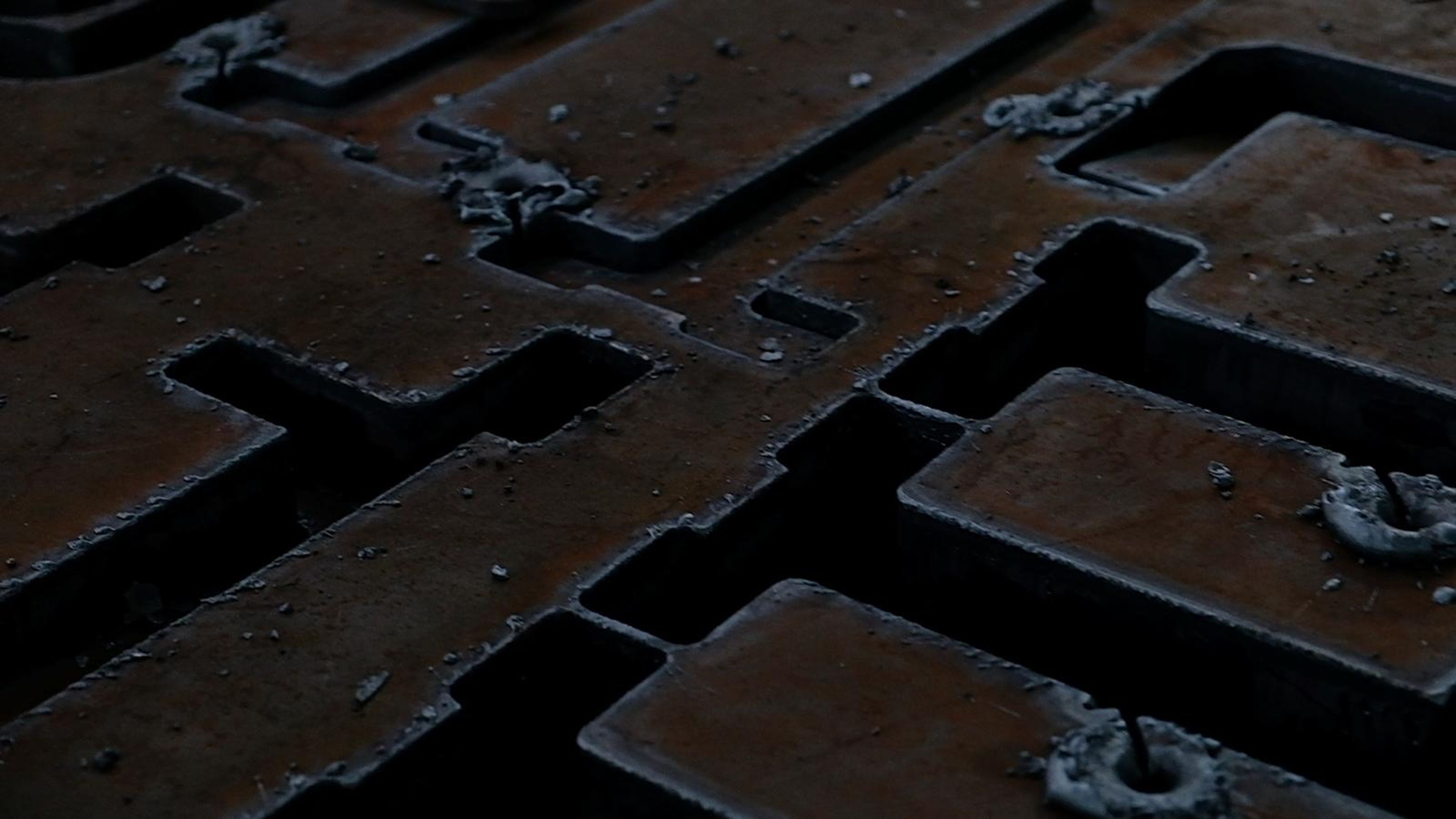 Close view of a steel plate with intricate cut profiles