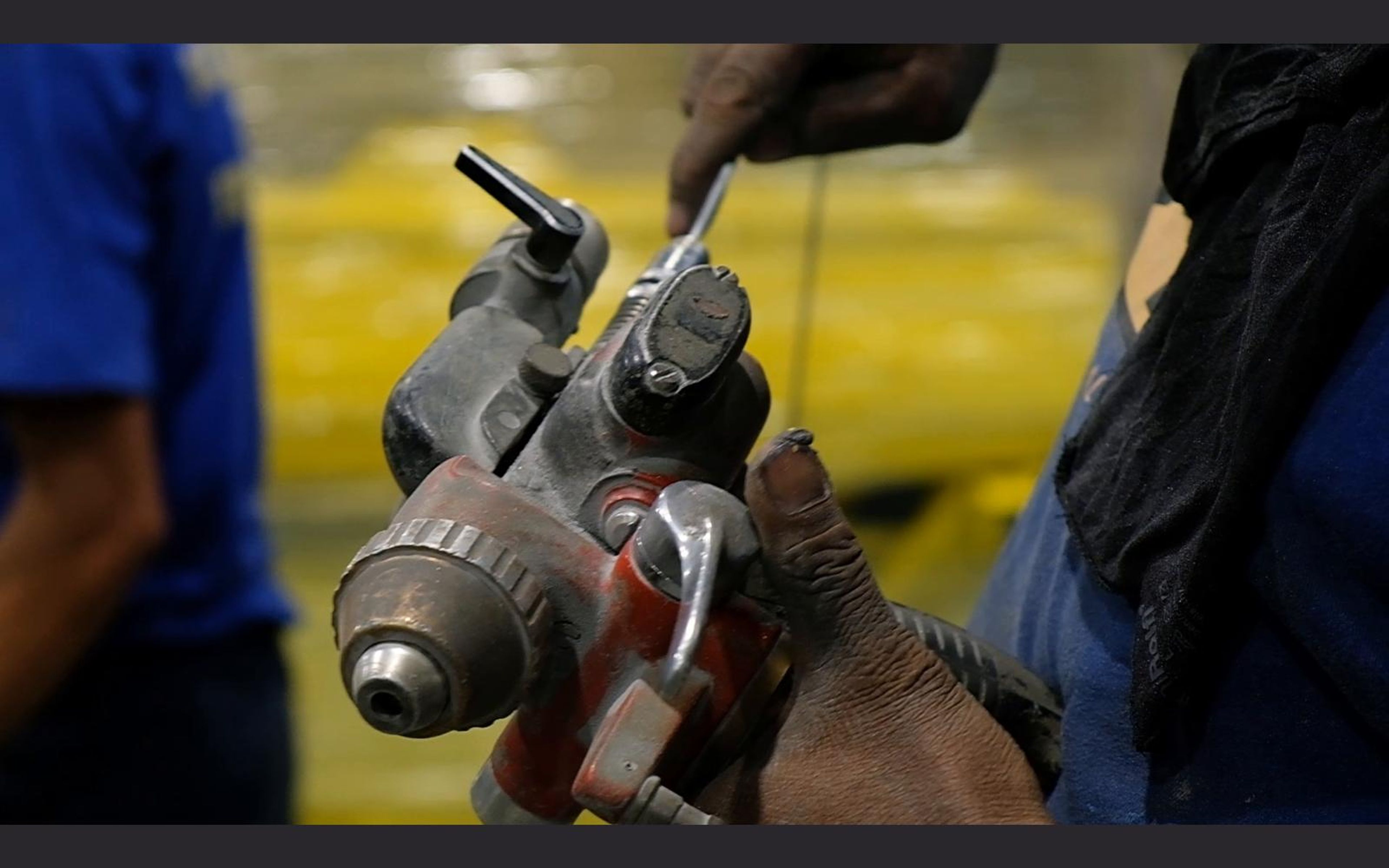Spray gun held close to steel