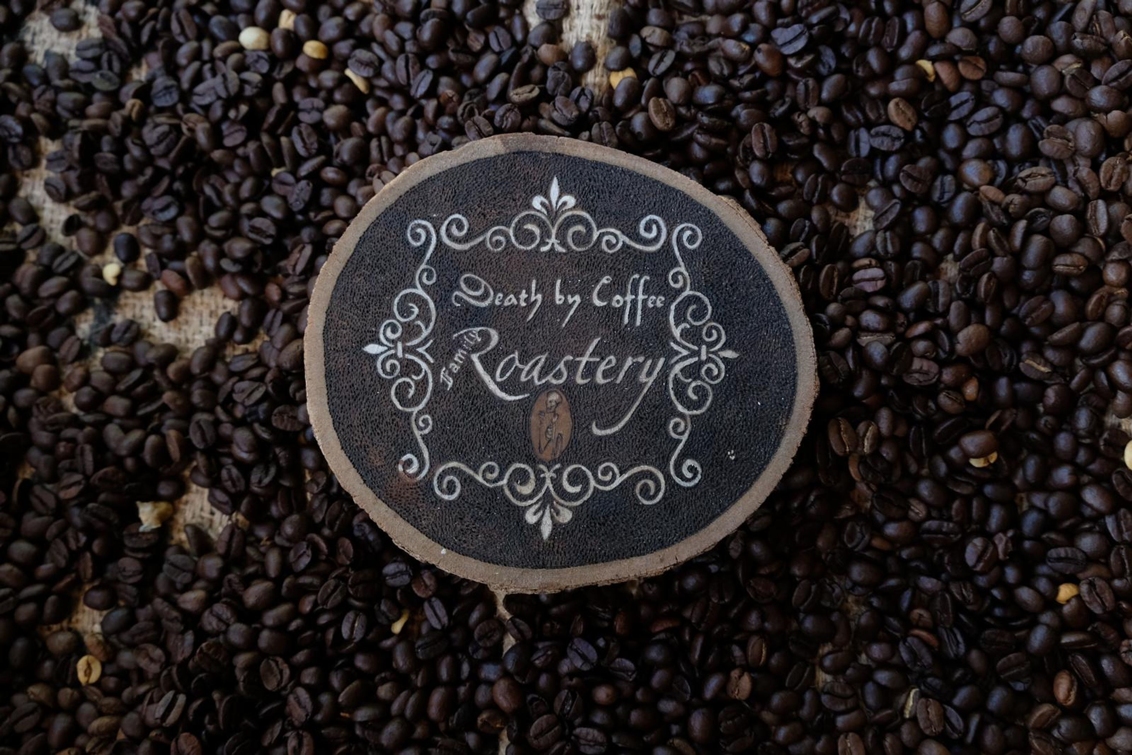 Death By Coffee creative product photography of coffee, beans and branded bags