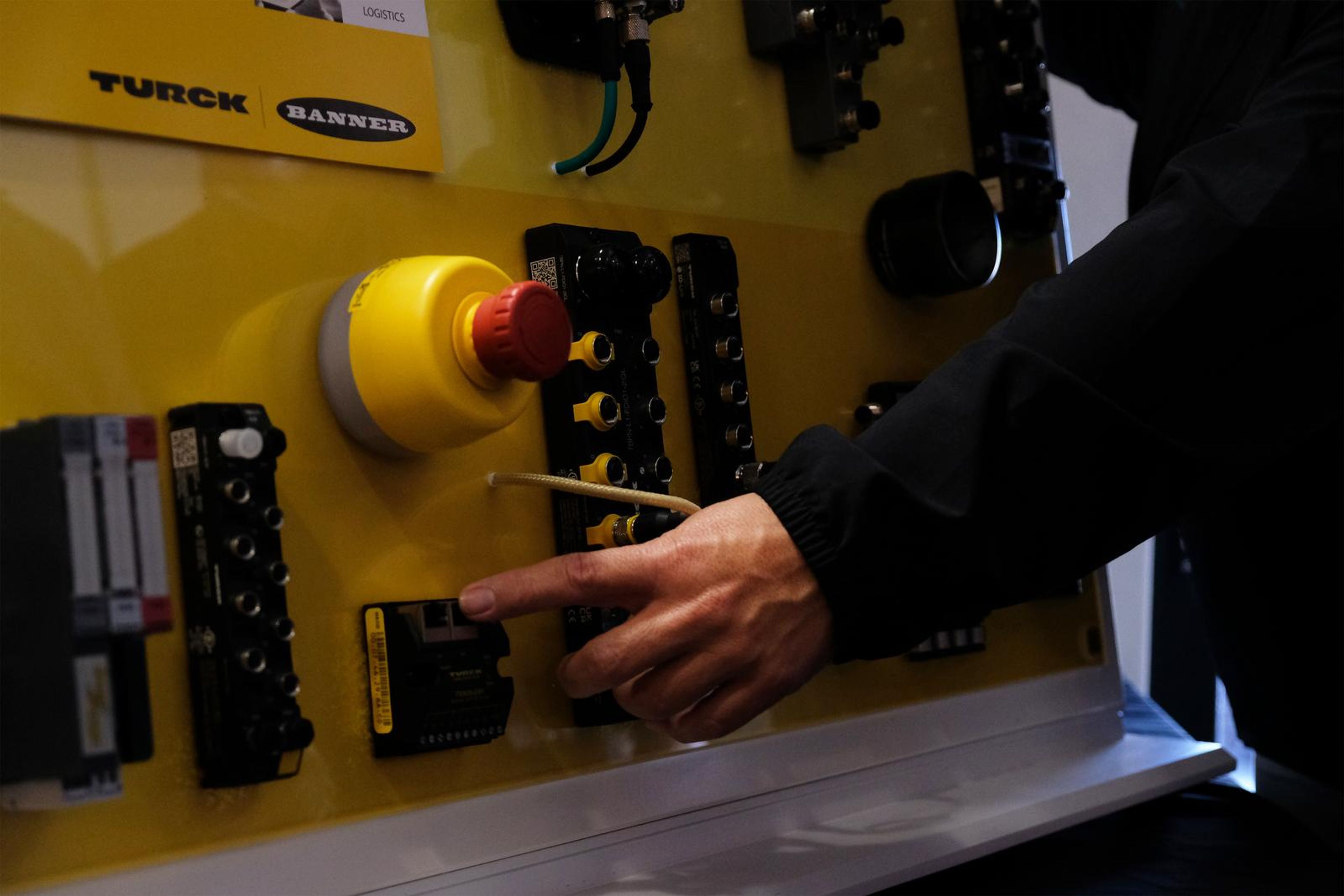 Hand on a Turck I/O demonstration panel