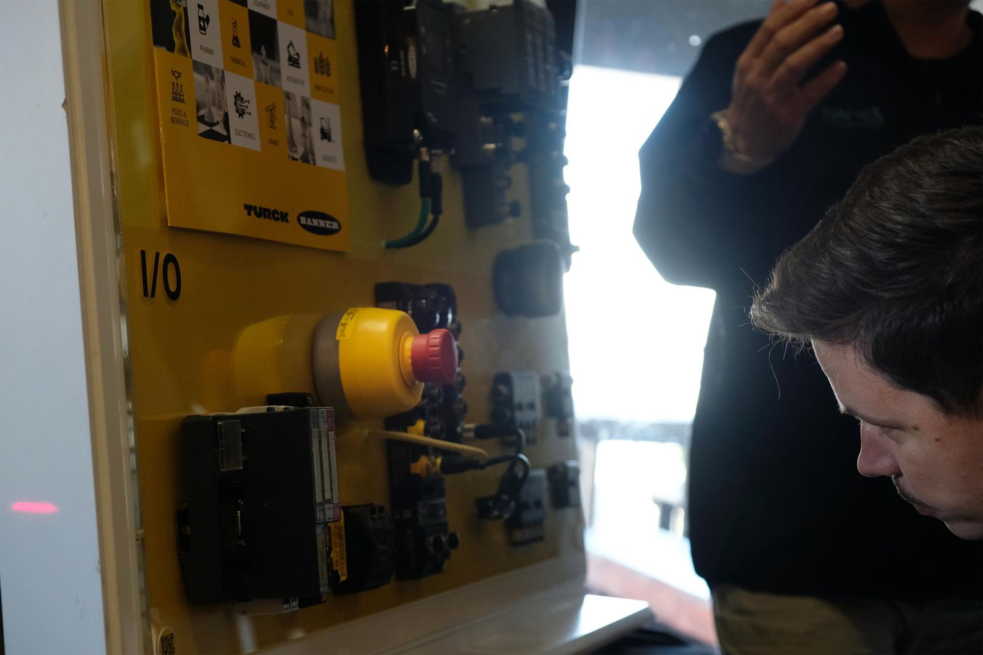 Turck yellow demonstration panel with an emergency stop and I/O modules