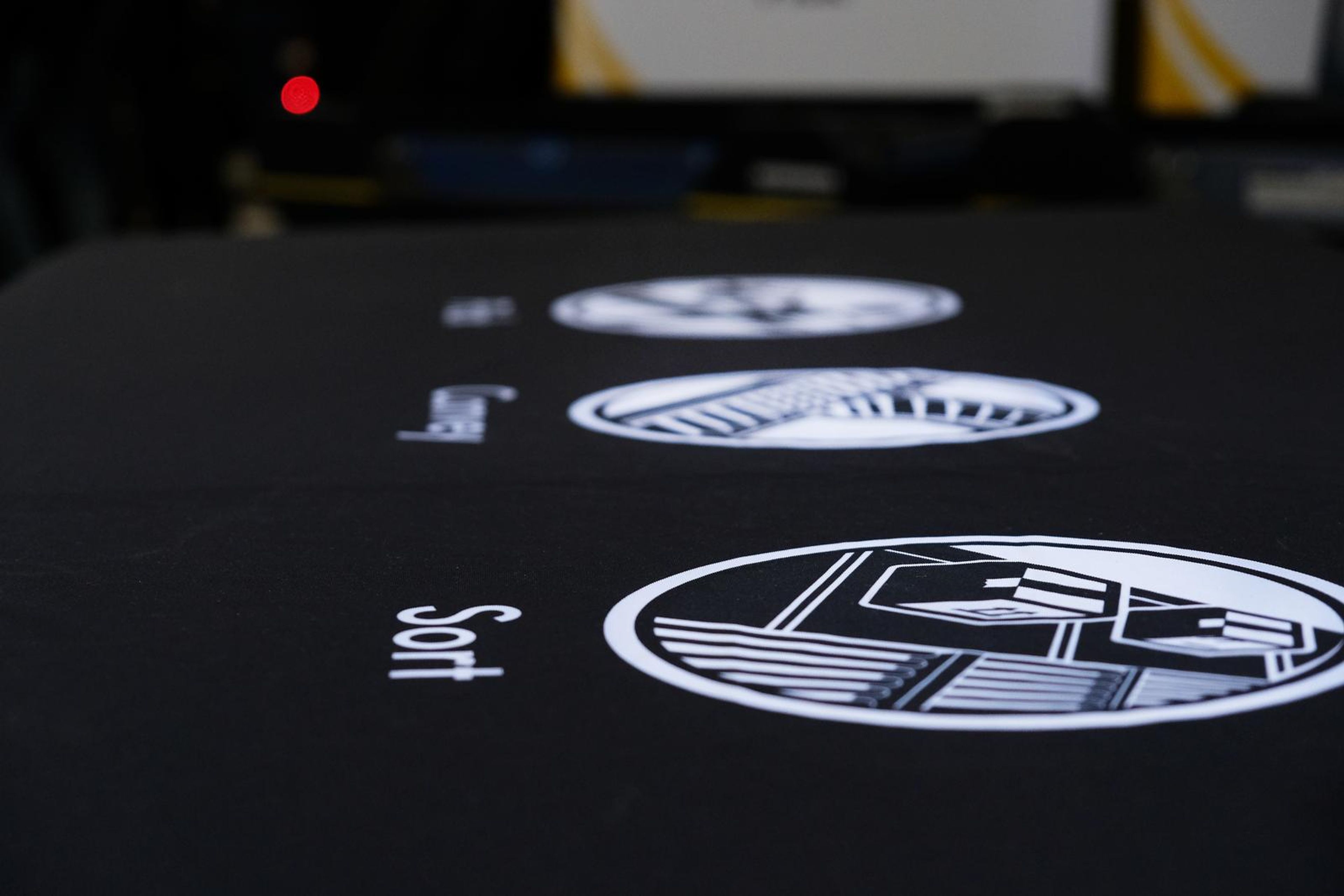 Interroll pick and sort icons on a black display