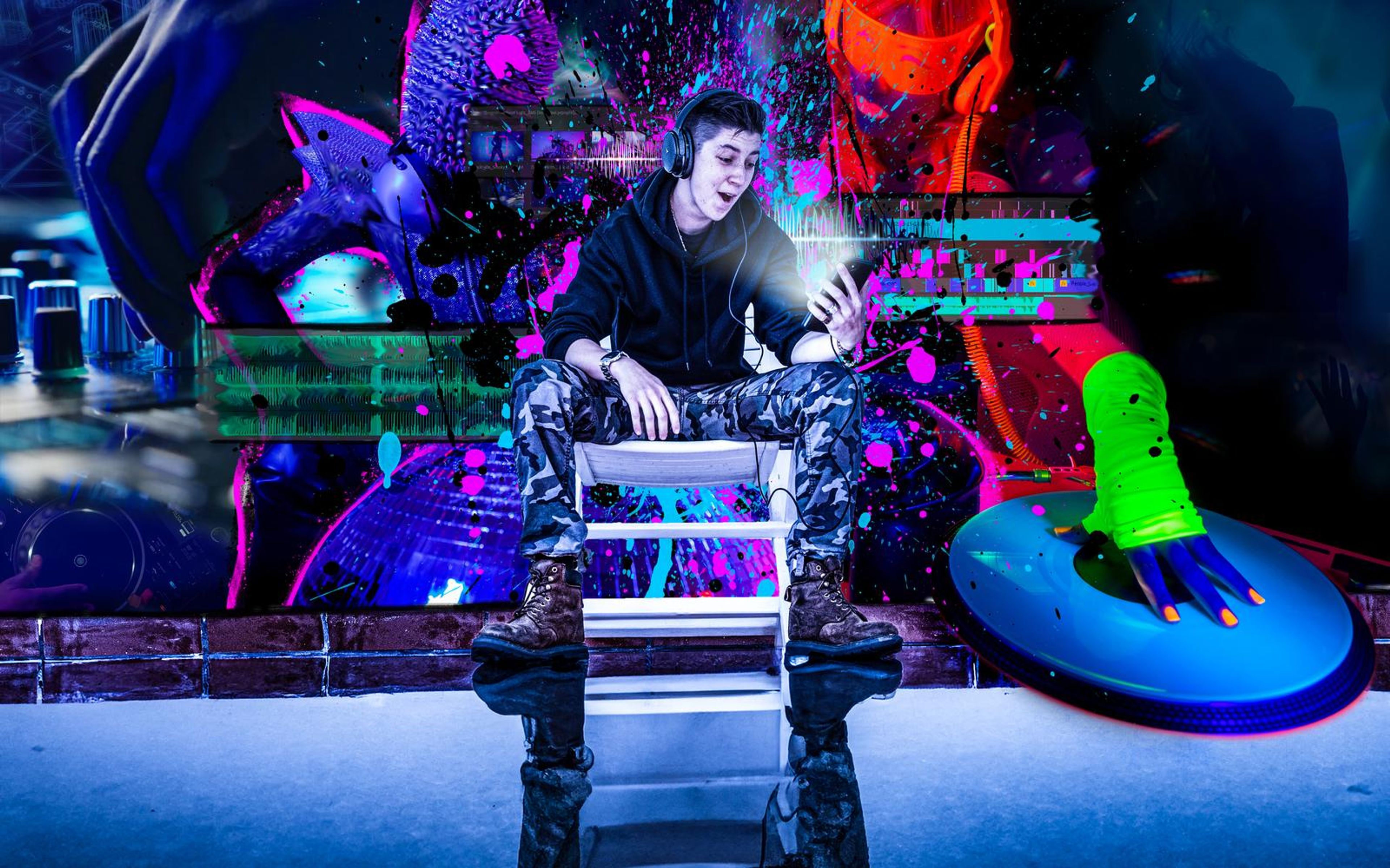Man in a black hoodie and headphones on a white chair looking at his phone, inside a neon collage of masked and helmeted figures