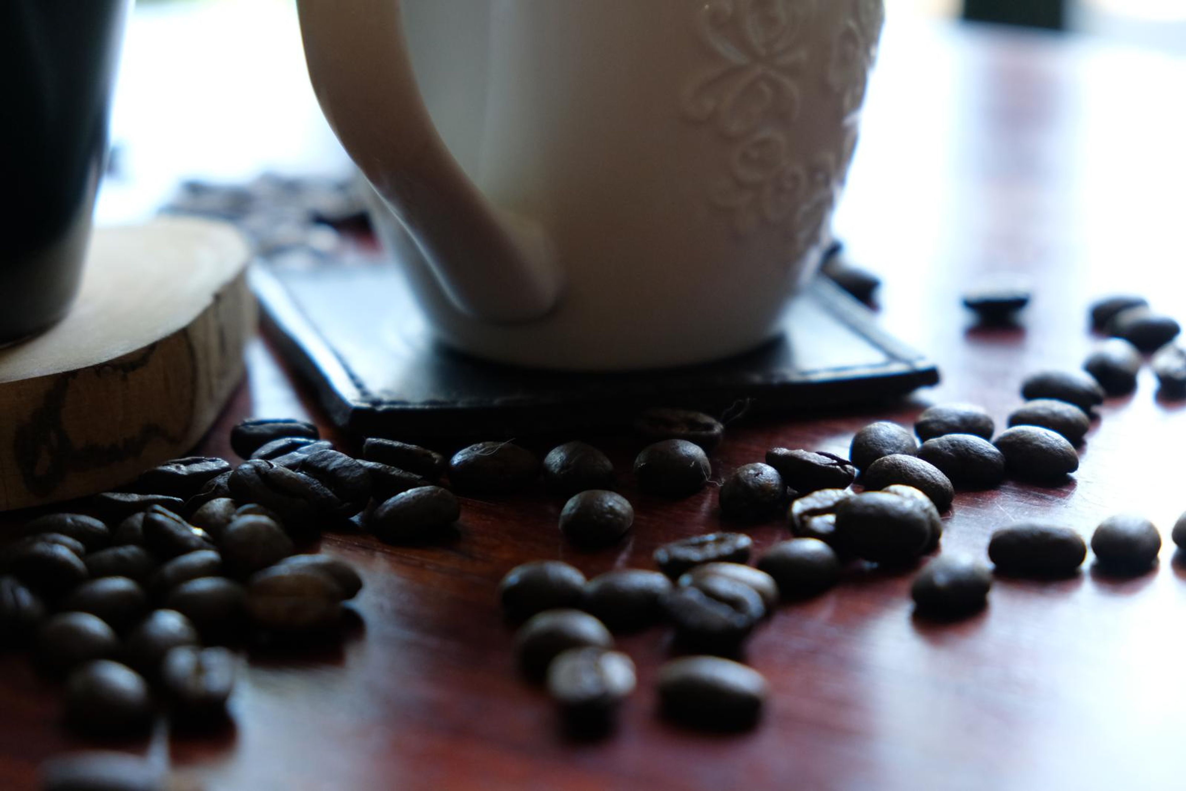 Death By Coffee creative product photography of coffee, beans and branded bags