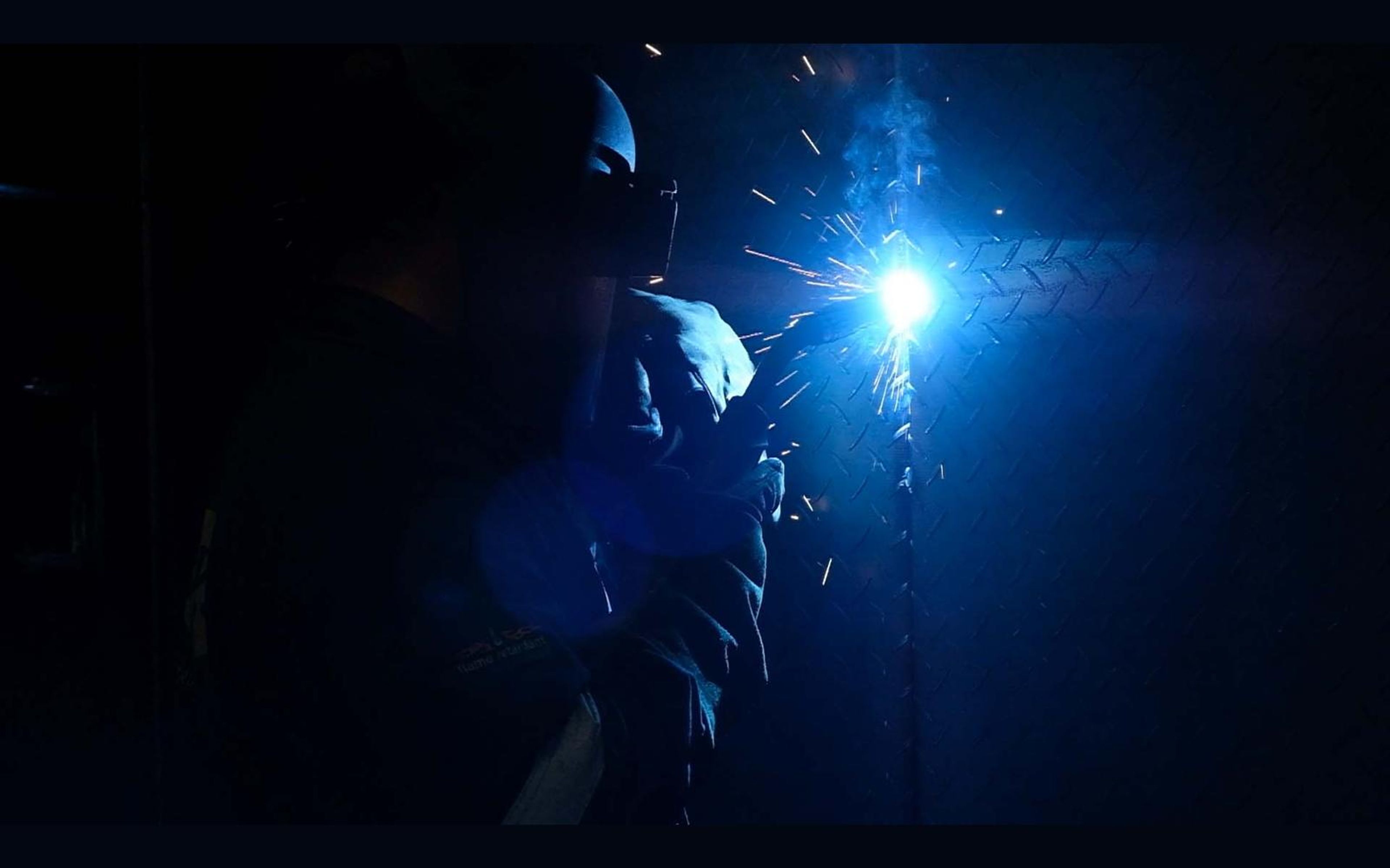 Welding flare in a dim fabrication bay