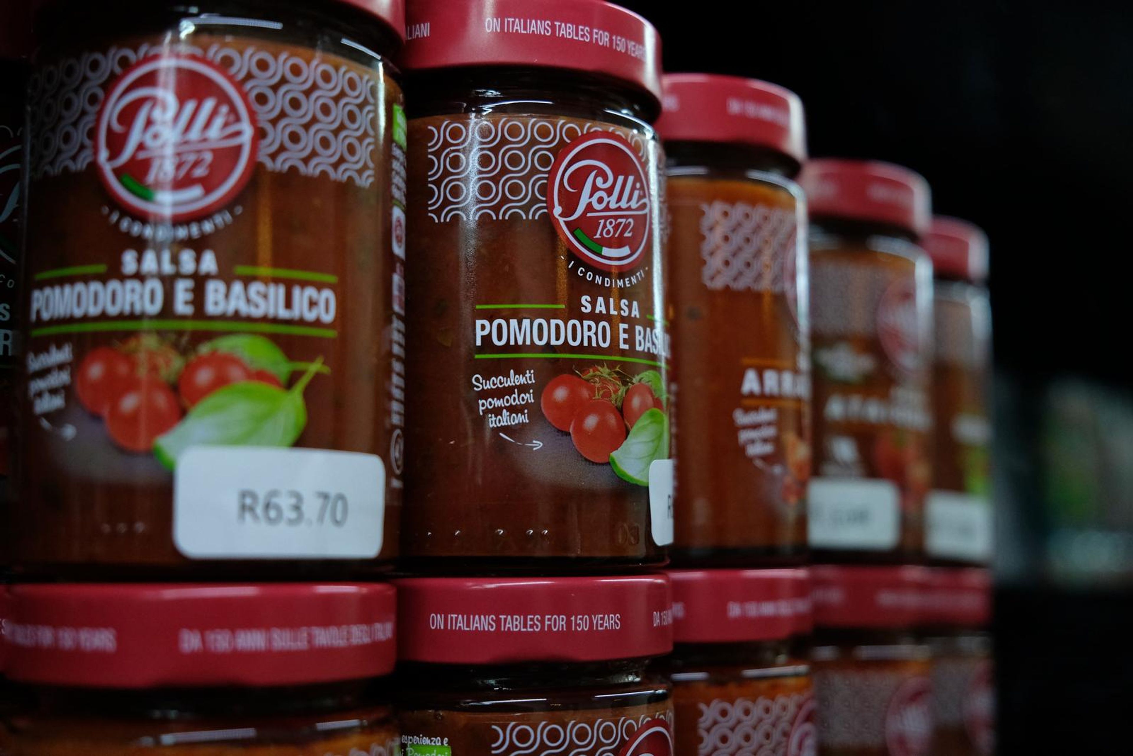 Jars of Polli tomato sauces stacked on the shelf