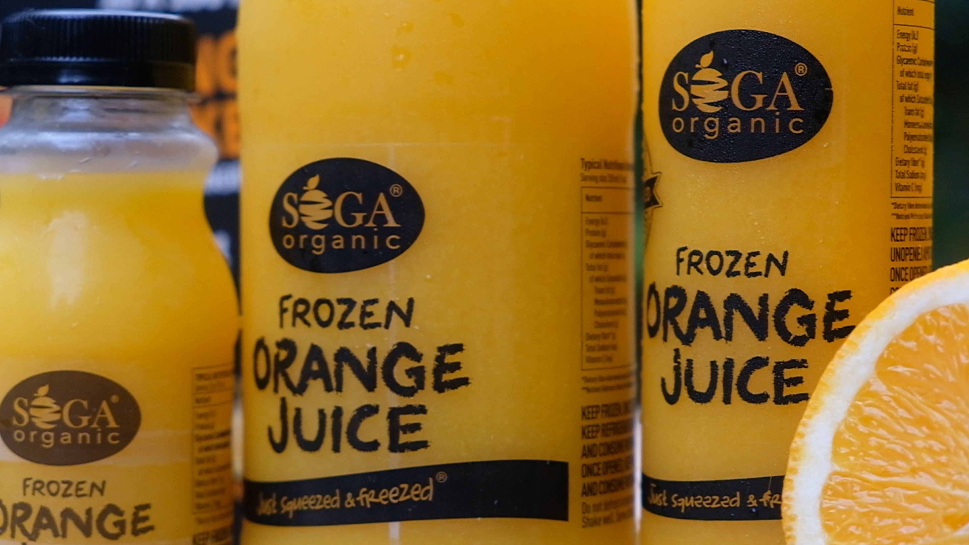 Close view of the Soga Organic frozen orange juice labels