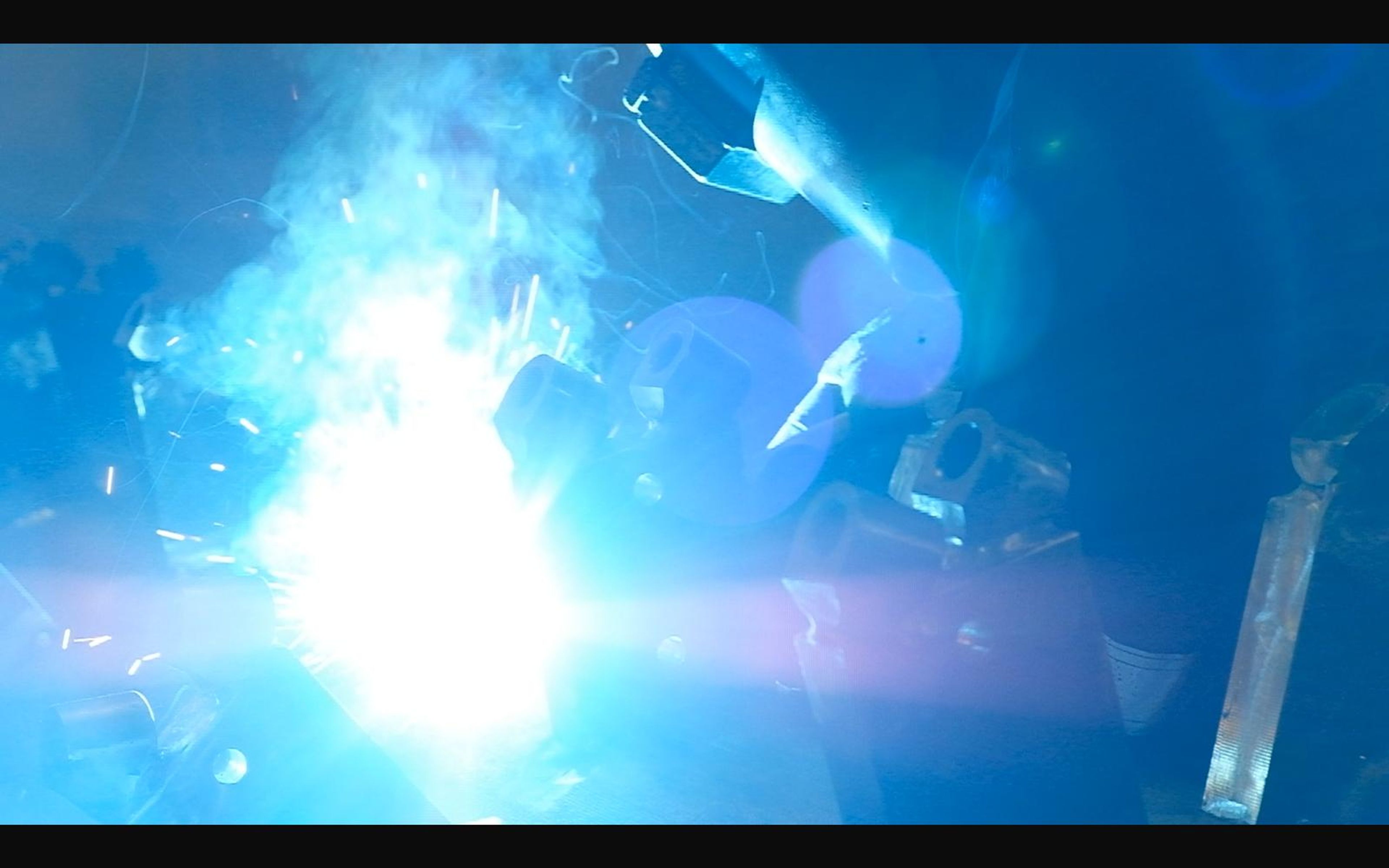 Bright welding arc on steel brackets