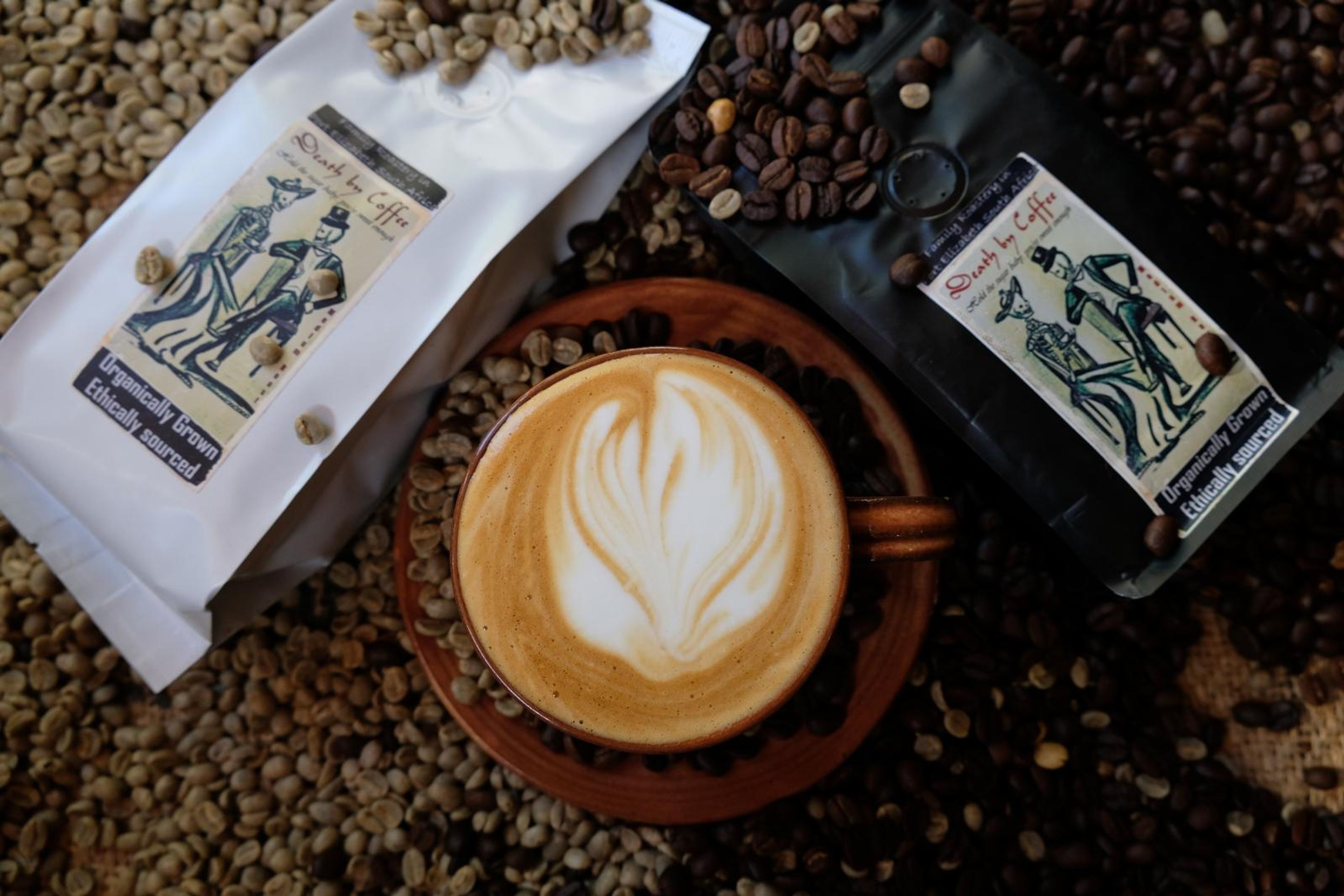 Death By Coffee creative product photography of coffee, beans and branded bags