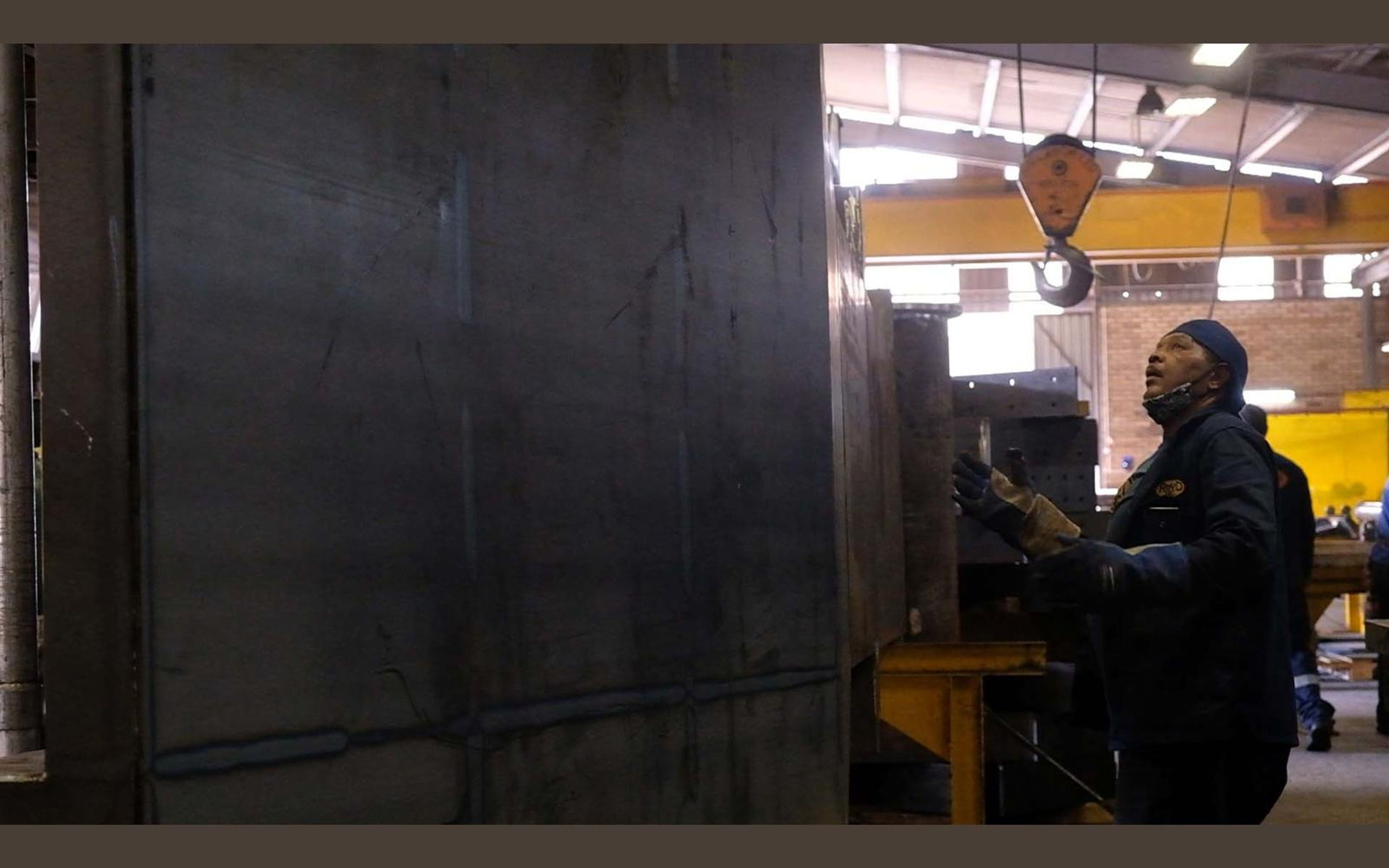 Wide view of the fabrication sector with steel frames on the floor