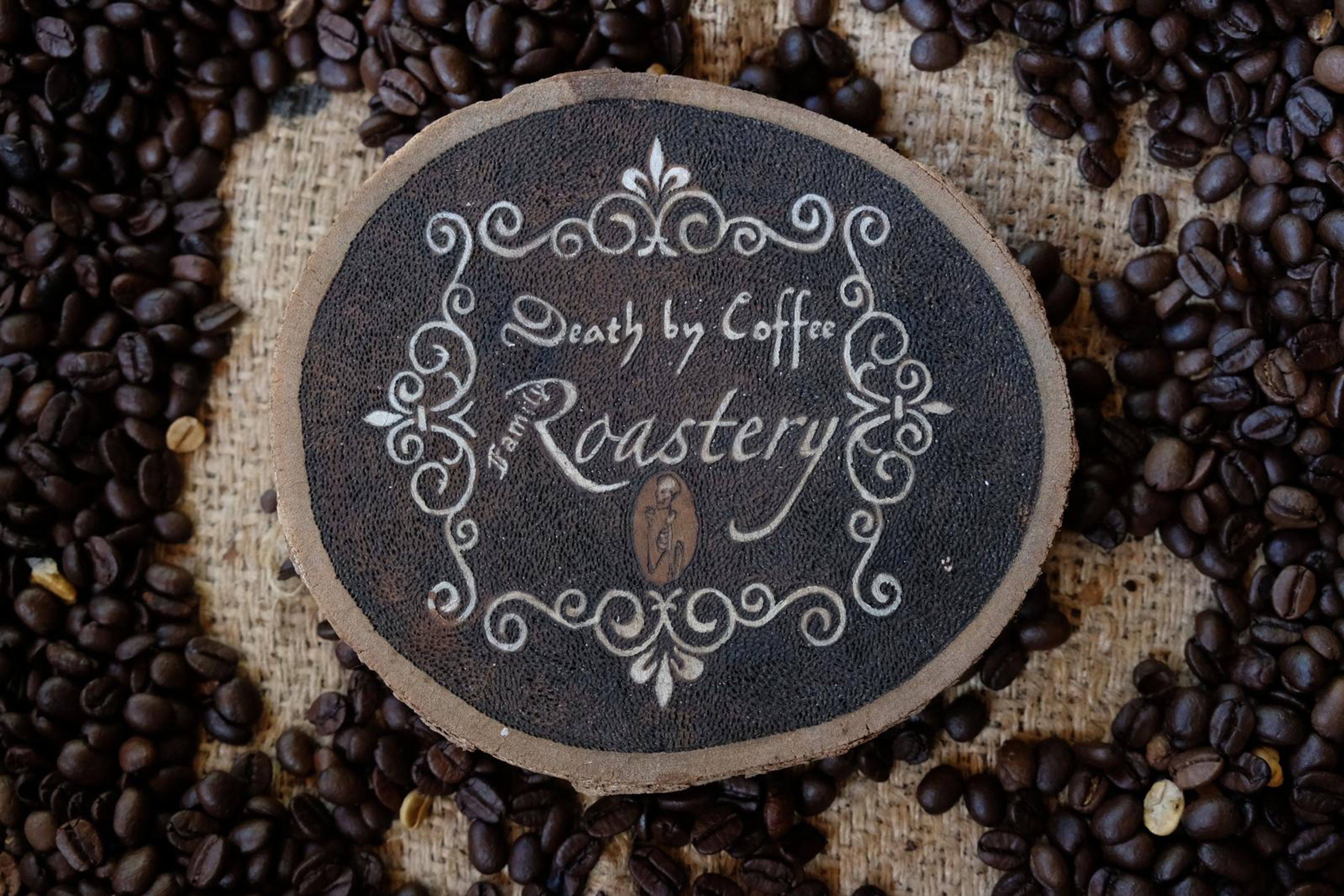 Death By Coffee creative product photography of coffee, beans and branded bags