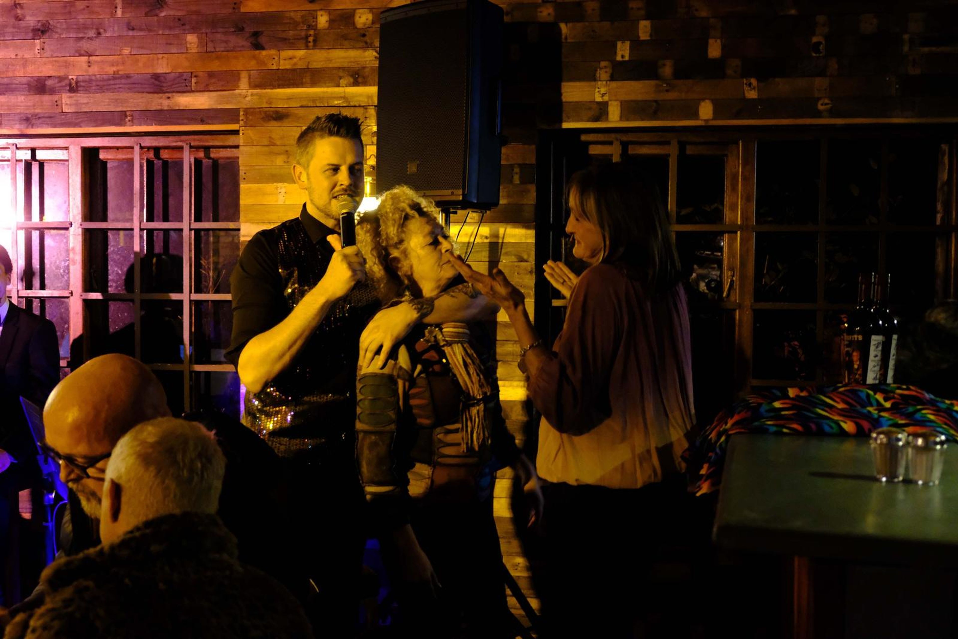 Lead singer dancing with a guest in the middle of the room